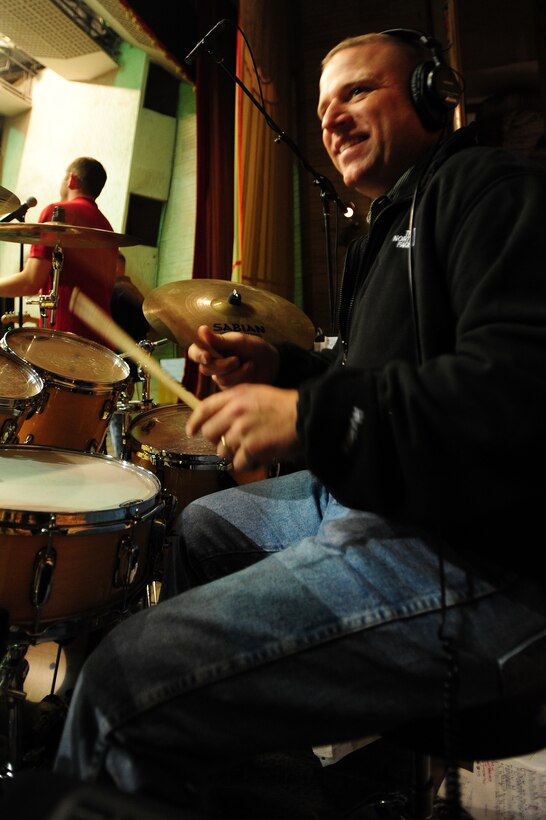 BISHKEK, Kyrgyzstan -- Master Sgt. Anthony DeLuzio, U.S. Air Forces Central Sirocco Band drummer, plays during a show in Kyrgyzstan, Nov. 13, 2009. (U.S. Air Force photo/Senior Airman Steele C. G. Britton)