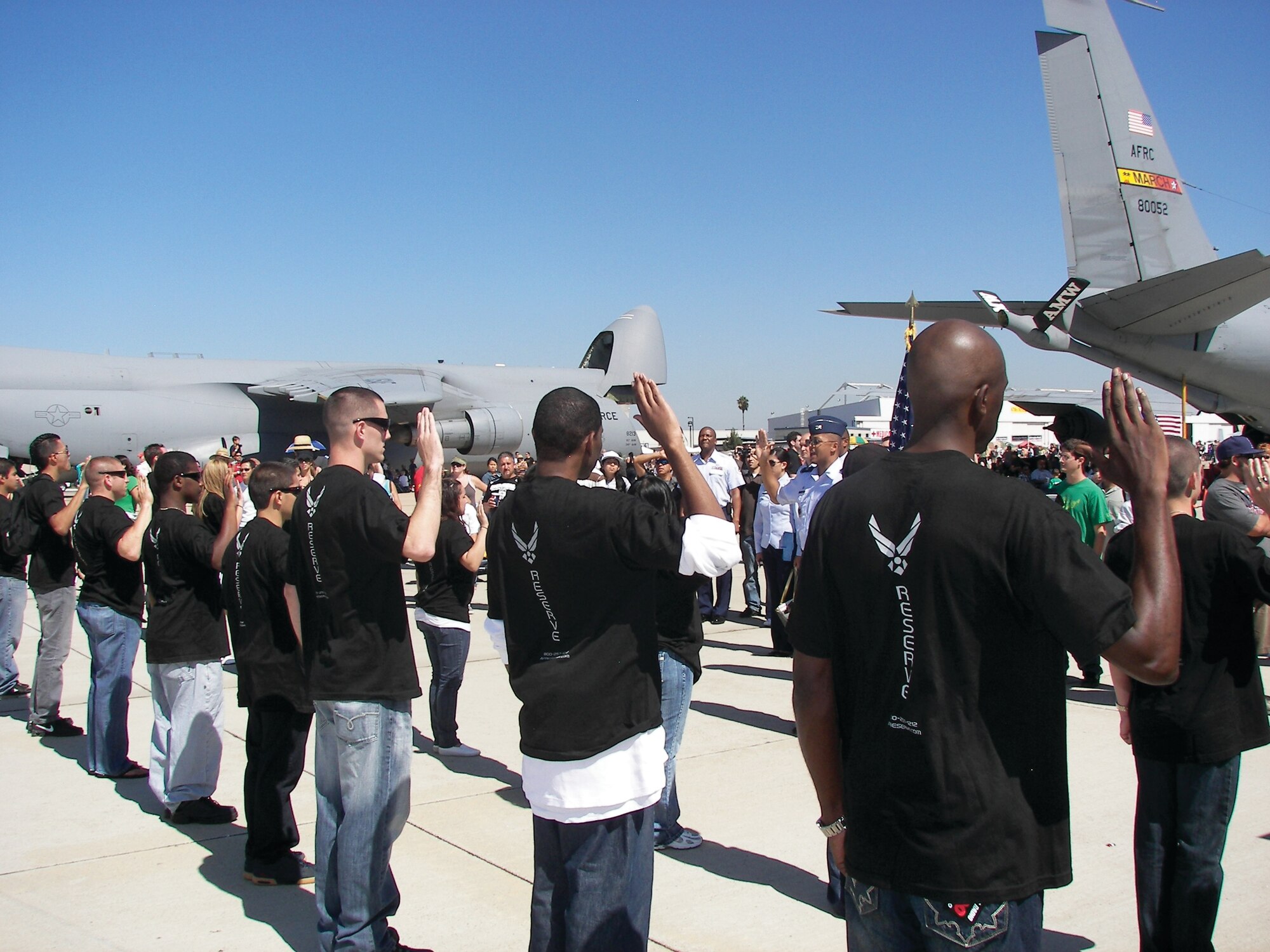 Col. Joe Wilburn, commander of Air Force Reserve Command Recruiting, administers the oath of enlistment to 23 new enlistees at Miramar Naval Air Station.  The 452nd Recruiting Service Squadron had the third highest number of new enlistees of all units holding mass enlistments in AFRC.  The nationwide mass enlistment is held annually at the conclusion of each fiscal year.  (U.S. Air Force photos by Senior Master Sgt. Mark Scully)