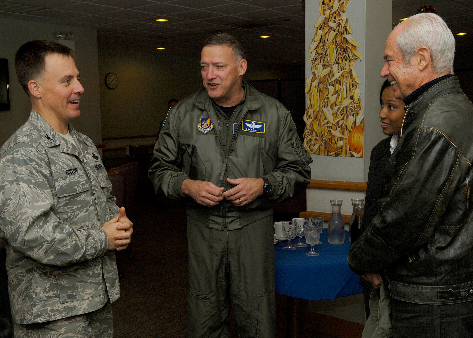 Col. Robert Givens, 8th Fighter Wing commander, Kunsan Air Base, Republic of Korea, chats with Gen. Gary North, Pacific Air Forces commander, Lena Lopez, chief community relations at PACAF, and Les Enderton, Executive Director of the Oahu Visitors Bureau at the O’Malley Dining Facility Nov.23.  General North is sponsoring four civic leaders from the Air Force Civilian Advisory Council as they tour Kunsan and Osan Air Bases, ROK, Nov. 21-23.  The purpose of the trip is for General North to celebrate Thanksgiving with the Airmen while the civic leaders get a better understanding of life for Airmen assigned to the ROK. (U.S. Air Force photo/Tech. Sgt. Jerome S. Tayborn)  