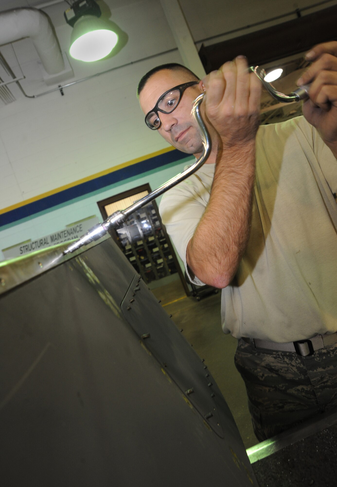 Tech. Sgt. John Fitzpatrick repairs cracks on an engine sailboat panel for a KC-135 Stratotanker, at McConnell Air Force Base, Kan, on Nov. 16, 2009. Sergeant Fitzpatrick is a a structural maintenance craftsman assigned to the 931st Maintenance Squadron, a new unit within the 931st Air Refueling Group that was activated in October 2009. (U.S. Air Force photo/Senior Airman Jessica Lockoski)