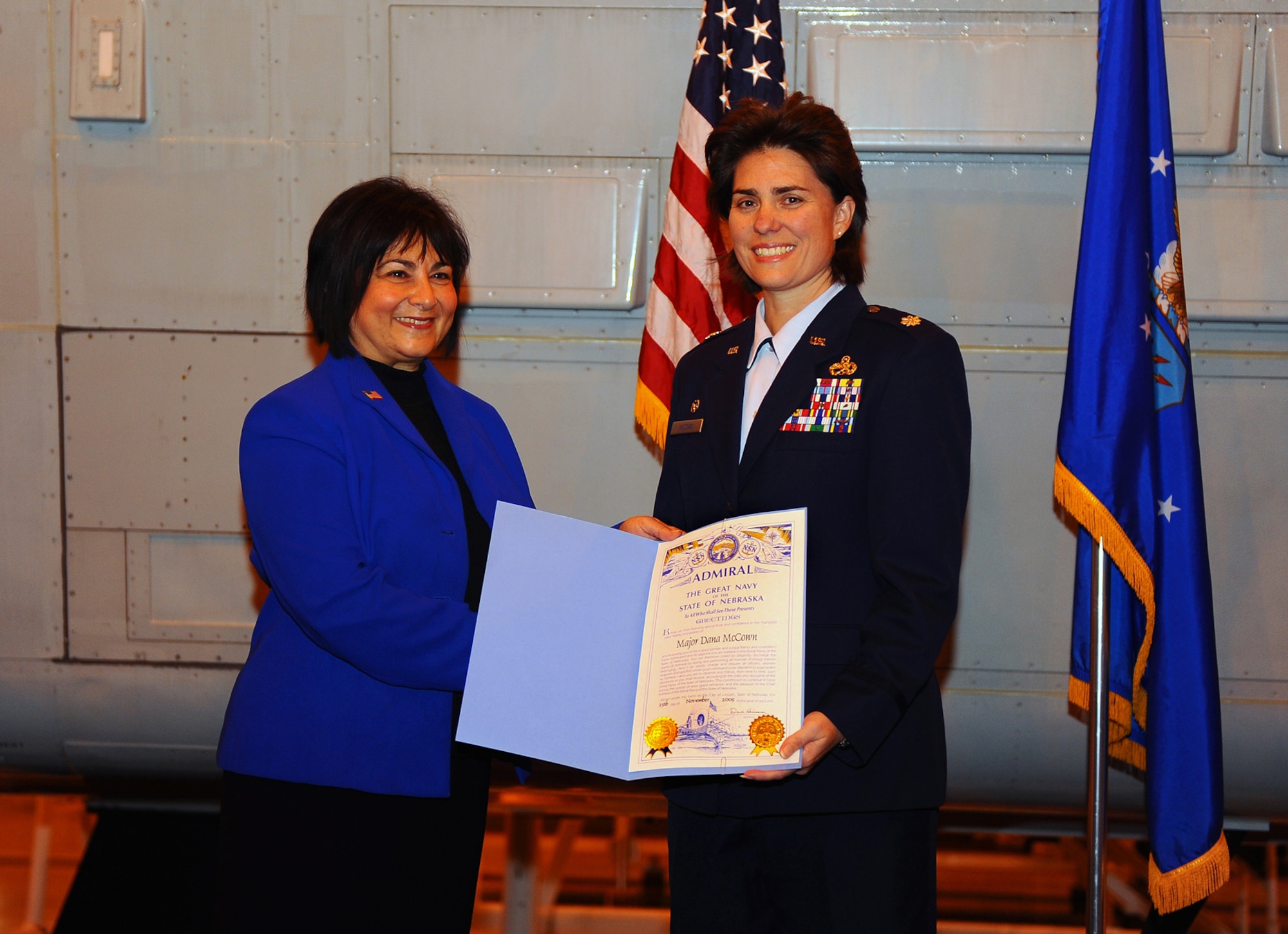 OFFUTT AIR FORCE BASE, Neb. - Nebraska first lady, Sally Ganem, presents Lt. Col. Dana McCown, 55th Maintenance Squadron commander, a certificate making her a Nebraska Admiral for her work with the Mothers Against Drunk Driving State Operations Council Executive Committee. U.S. Air Force Photo by Josh Plueger