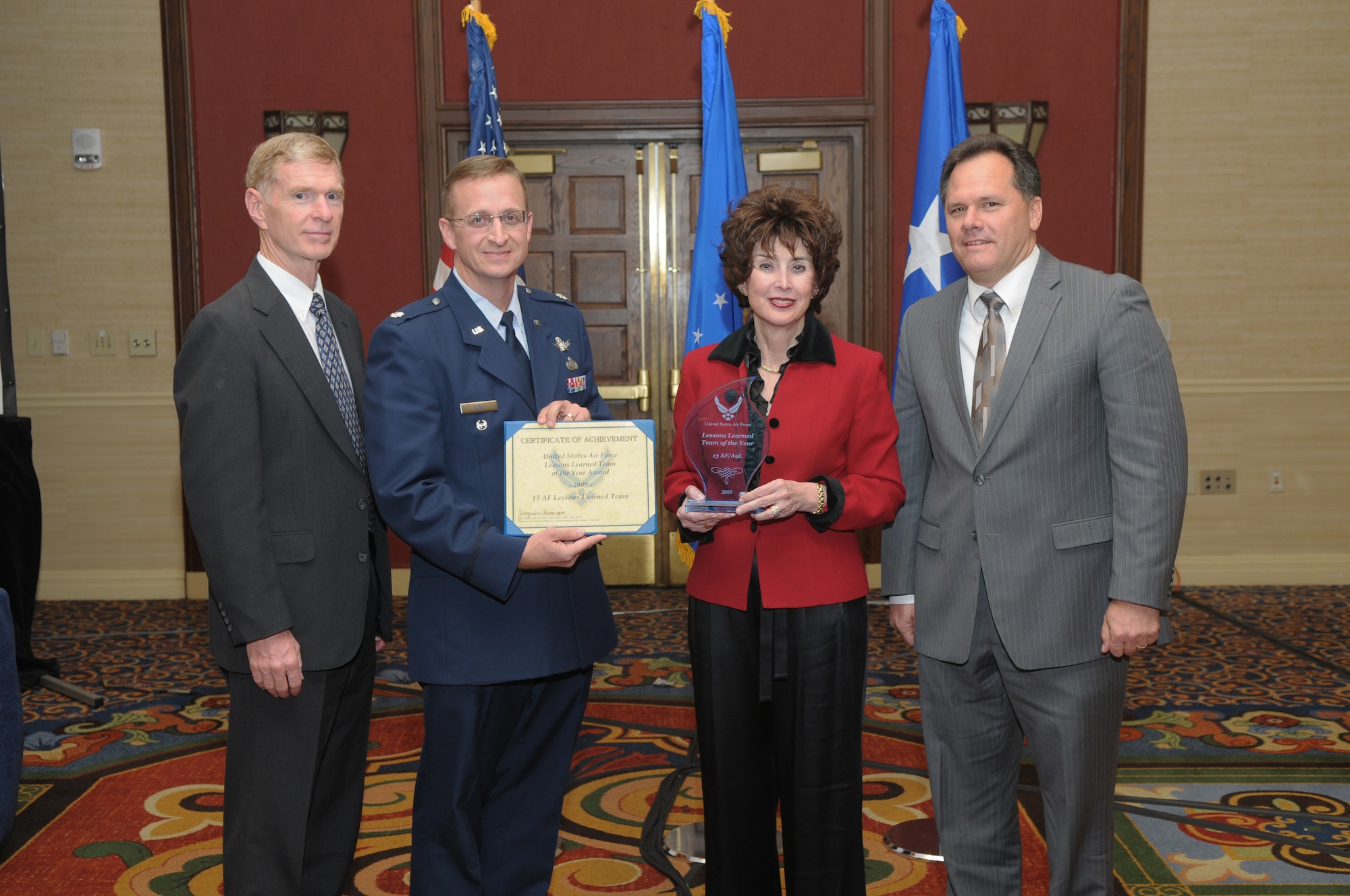 Dr. Jacqueline Henningsen,  director of the Air Force Studies & Analyses, Assessments and Lessons Learned directorate at the Pentagon, Washington D.C., Dan Ashcraft (left), Lt. Col. Scott Long, and John Trifonovitch, members of 13th Air Force at Hickam Air Force Base, Hawaii attend the 2009 Air Force Analyses, Assessments and Lessons Learned awards ceremony in San Antonio, Texas, Nov. 18, where their 13th Air Force team was named the Lessons Learned Outstanding Team of the Year.  The award recognizes analyses, assessments and lessons learned professionals who provide superior insight and analyses that improve military operations at the strategic, operational and tactical levels of command and result in long-term internalized change for an organization. (coutesy photo) 
