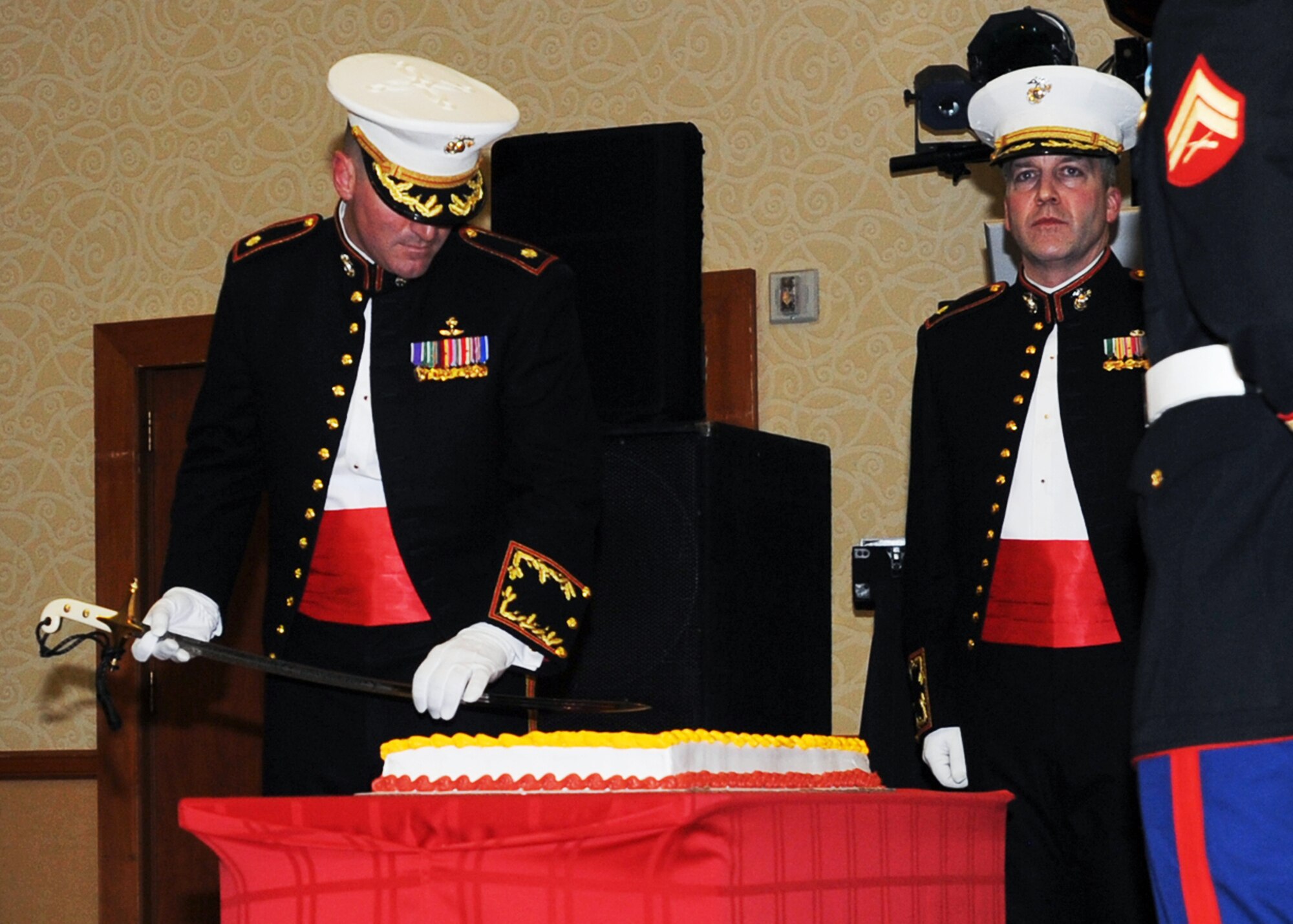 ANCHORAGE, Alaska -- Maj. William Allen, commander of D Company (-) Anti-Terrorism Battalion 4th Marine Division, cuts the birthday cake during the United States Marine Corps 234th Birthday Ball Nov. 21, 2009 at the downtown Anchorage Hilton. The ball was held in memory and in honor of Marines and Sailors past and present, and American citizens around the world who are heroically defending the cause of freedom and liberty. (U.S. Air Force photo/Senior Airman Laura Turner)
