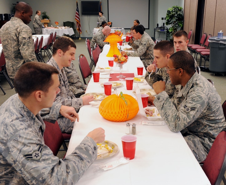 MOODY AIR FORCE BASE, Ga. -- Airmen enjoy their food and the company at the Base Chapel during the Airmen Thanksgiving Luncheon here Nov. 24. The luncheon was geared toward single Airmen living on base who may not be celebrating the holiday with family. (U.S. Air Force photo by Airman 1st Class Joshua Green)