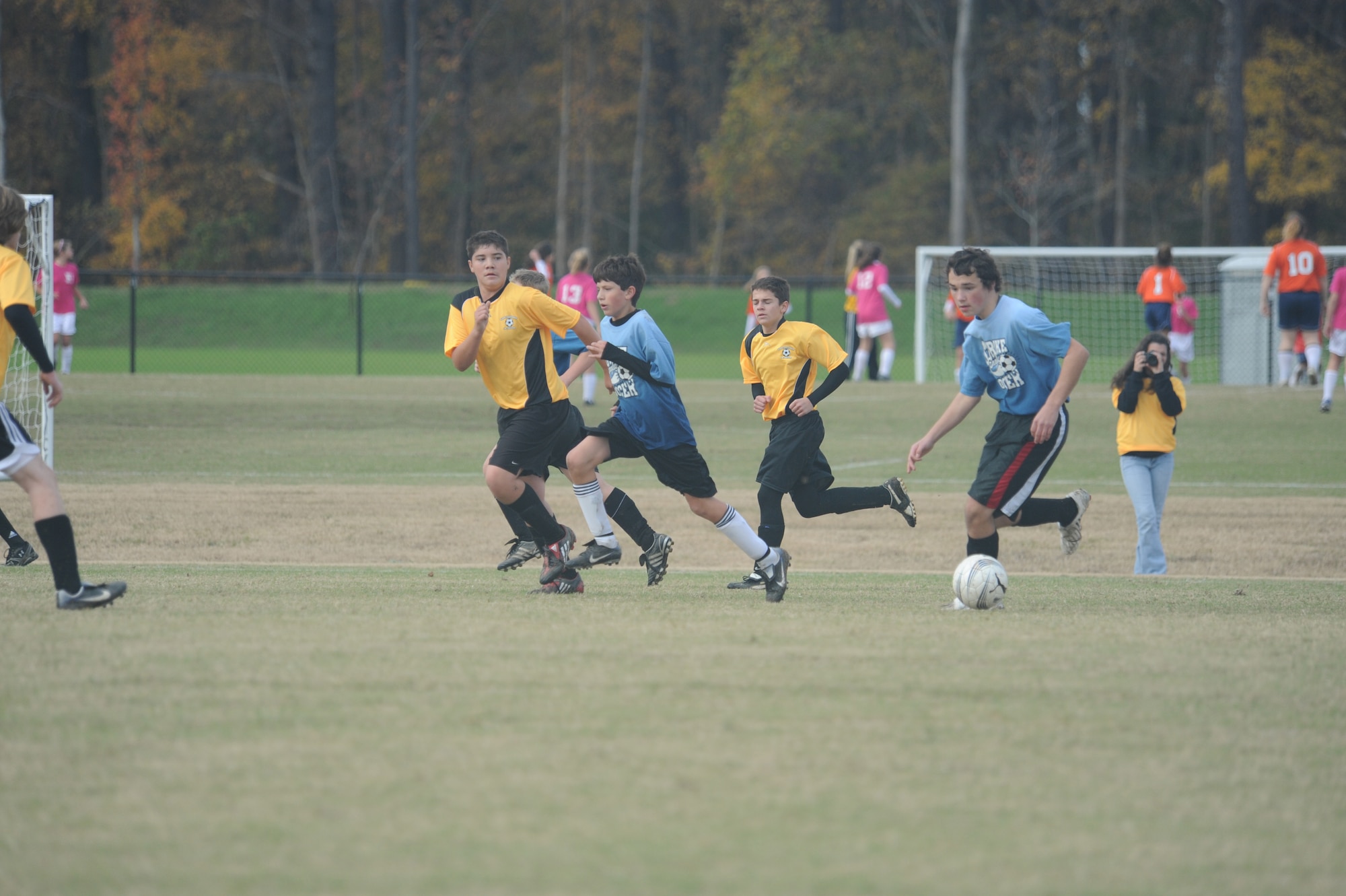 Brandon Fossett, Strike Eagle FC midfielder, leads the charge, dribbling a ball through the Davidson County defense during a two-day 2009 State Wide Athletic Counsel Tournament held at the Rocky Mount Sports Complex, in Rocky Mount, N.C., Nov. 21-22, 2009.  Kedric Lemon and Jordan Bailey each scored during the game, but came up short against Davidson County, 3-2. (U.S. Air Force photo/Tech. Sgt. Lesley Waters)