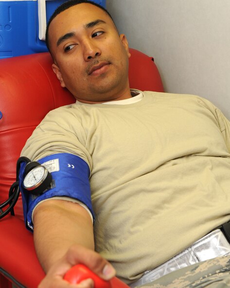 DYESS AIR FORCE BASE, Texas -- Staff Sgt. Juan Martinez, 7th Logistics Readiness Squadron vehicle operator, prepares to give blood at the Hanger Center here, Nov. 18. Dyess members came together with Meeks Blood Center to donate blood that will benefit community members within the city of Abilene and the surrounding areas. (U.S. Ai r Force photo/Senior Airman Jenifer H. Calhoun)