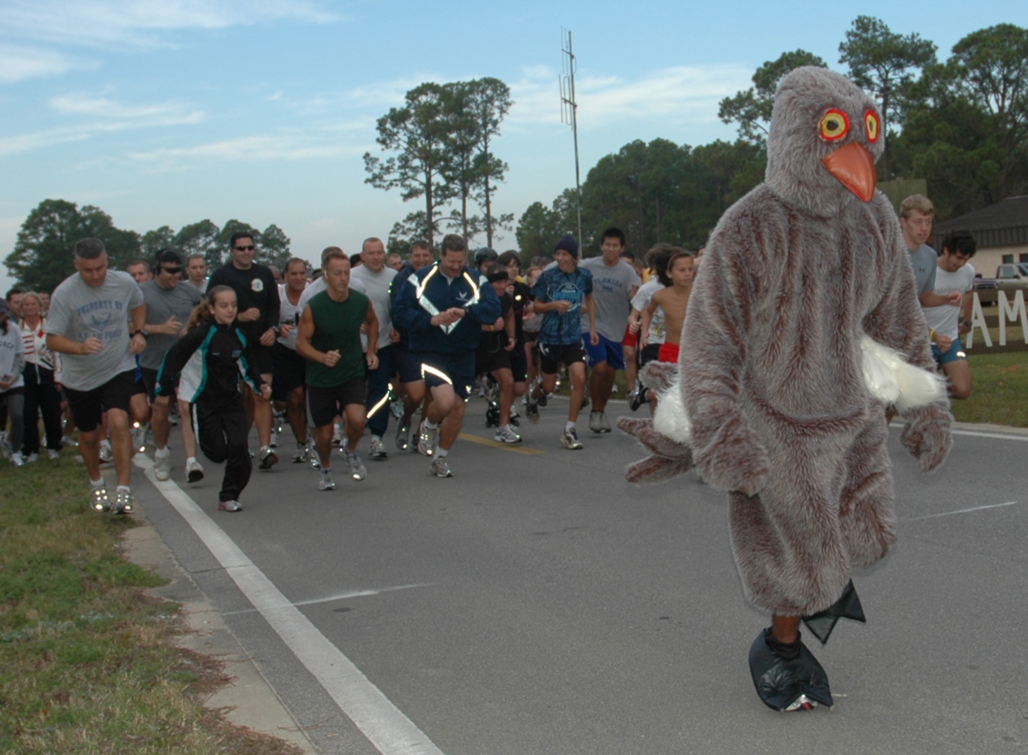 The Turkey Trot mascot and participants take off at the start of the 5k Turkey Trot at the Aderholt Fitness Center at Hurlburt Field Nov. 25. Event organizers said that attendance at this year’s run was the most of any previous Turkey Trot.  (Air Force photo by Airman 1st Class Joe McFadden)