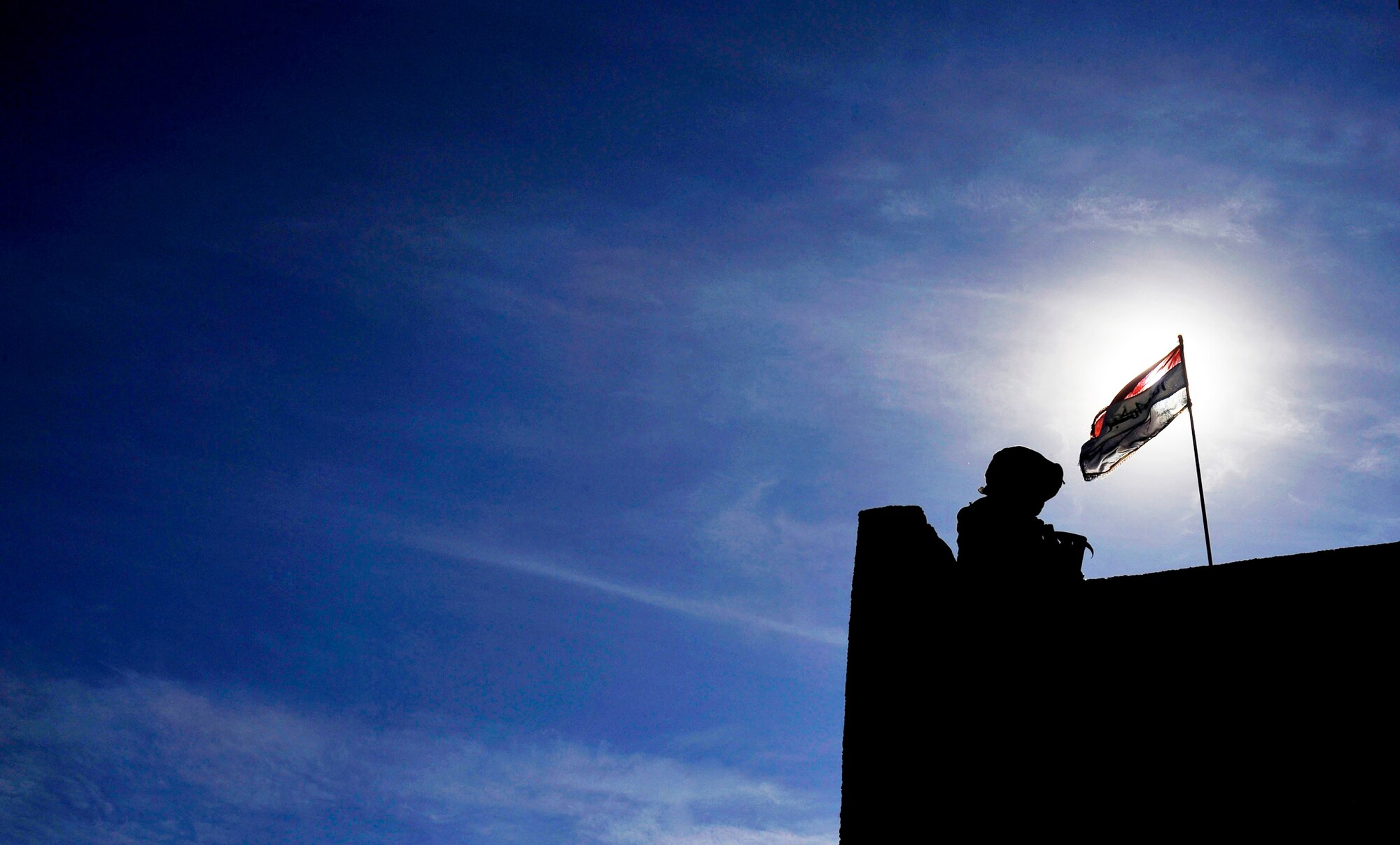 Senior Airman Joseph Mejia provides security at a local Iraqi police station during a meeting, Nov. 15, 2009, at Baghdad, Iraq. Airman Mejia is a  732nd Expeditionary Security Forces Squadron Det 2 fire team member  deployed to Baghdad, Iraq, (U.S. Air Force photo/Staff Sgt. Angelita Lawrence)