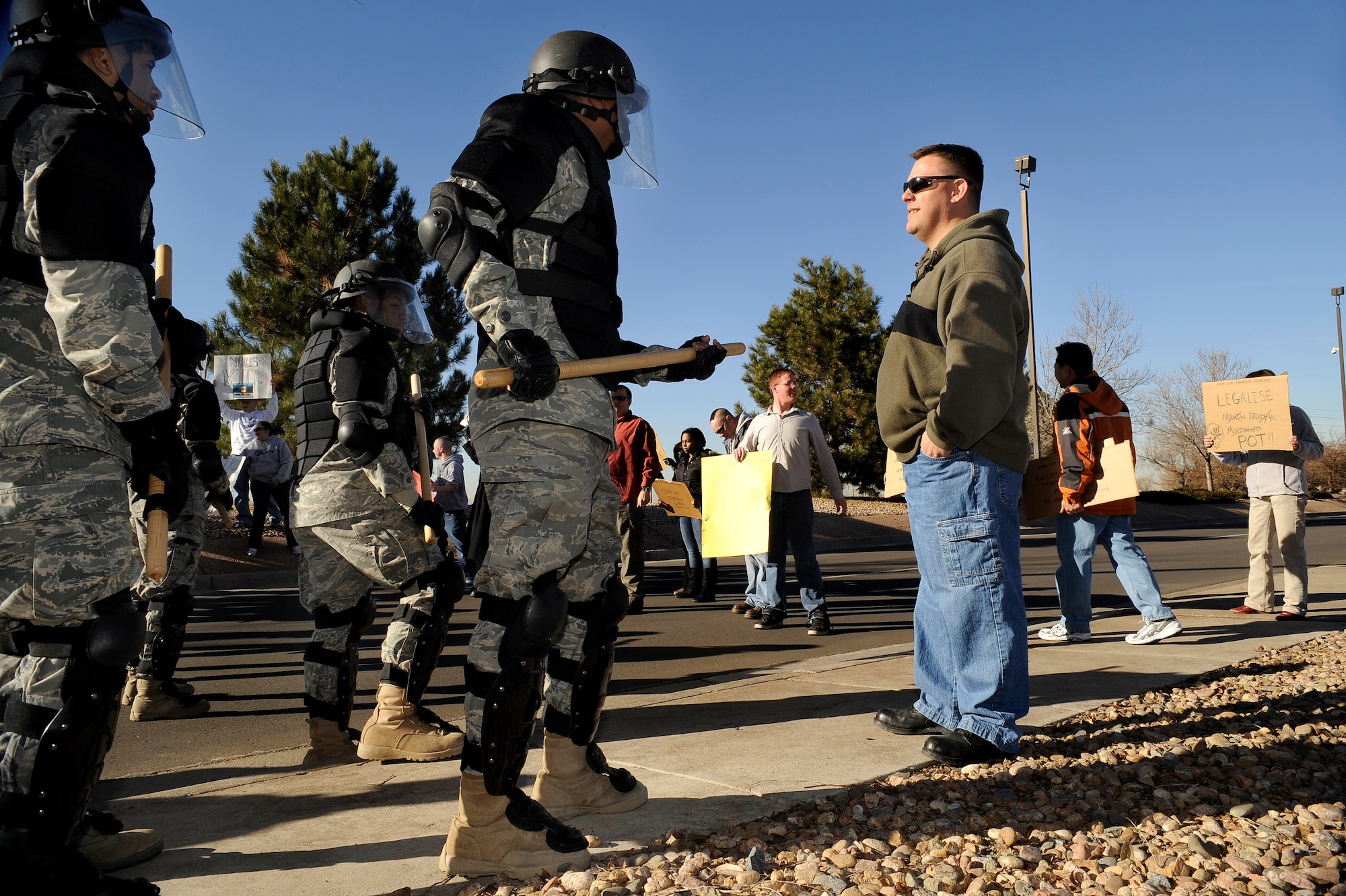 BUCKLEY AIR FORCE BASE, Colo. -- Members of the Buckley Air Force Base Confrontation Management Team make a barrier at the main gate during an exercise Nov. 24. (U.S. Air Force photo by Staff Sergeant Steve Czyz)
