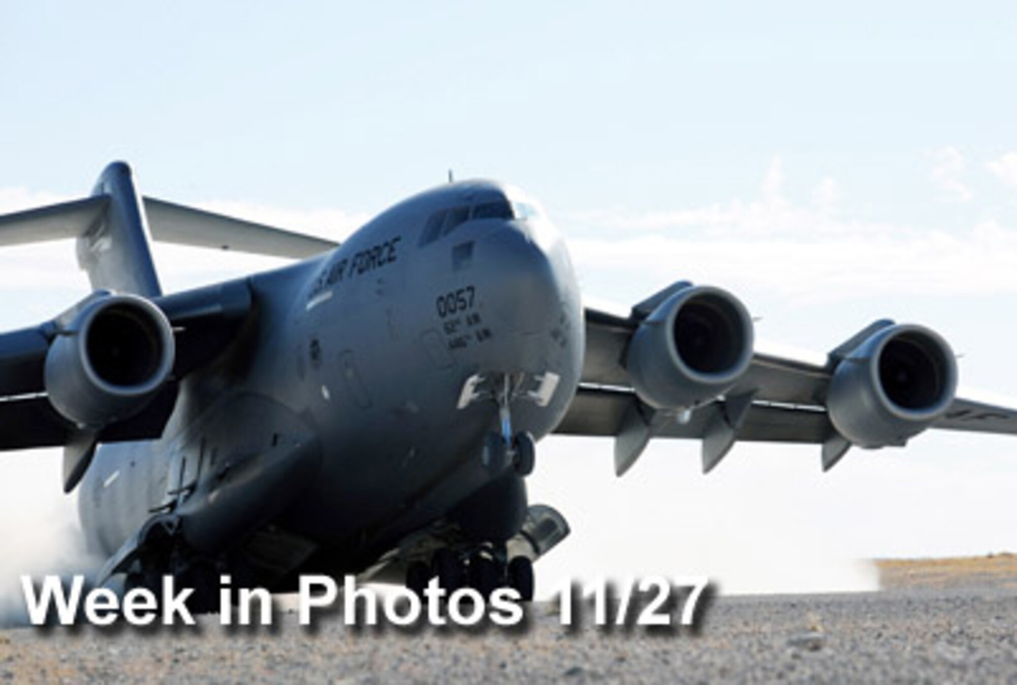 Air Force Week in Photos for Nov. 27 highlights photos from around the Air Force. In this photo by Airman 1st Class Brett Clashman, a C-17 Globemaster III takes off recently at an airfield on the Nevada Test and Training Range near Nellis Air Force Base during the Mobility Air Forces Exercise.  (U.S. Air Force photo illustration)
