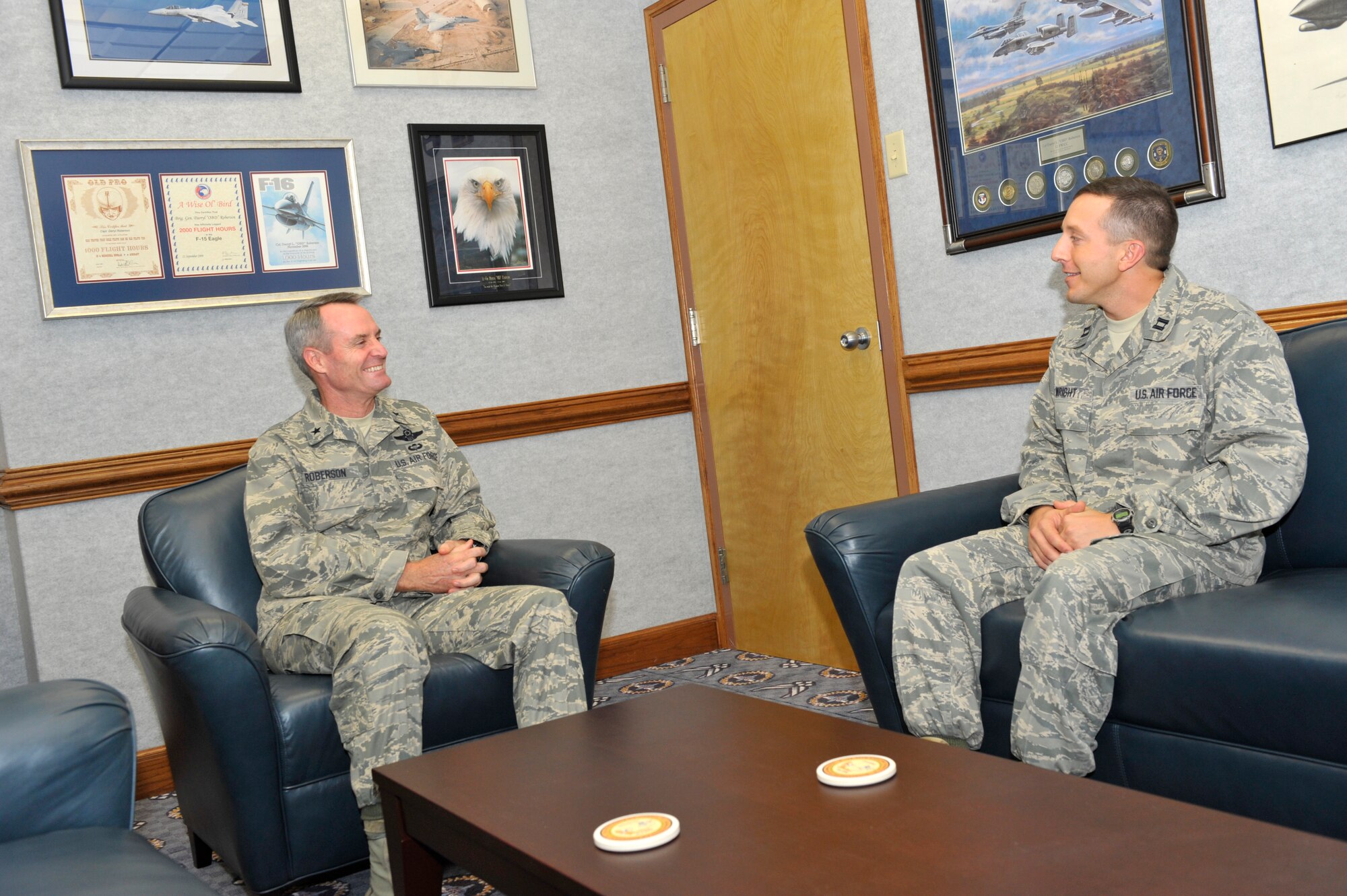 Captain David Wright, 325th Medical Group Mental Health Flight commander, shadows Brig. Gen. Darryl Roberson, 325th Fighter Wing commander, during the commander’s staff meeting Nov. 24.  Captain Wright leads/supervises psychology and social work professional and paraprofessional Mental Health, ADAPT and Family Advocacy staff. He spent the day with General Roberson as part of the Commander’s Shadow Program.  He has served more than four years in the Air Force.  (U.S. Air Force photo/Jonathan Gibson)  