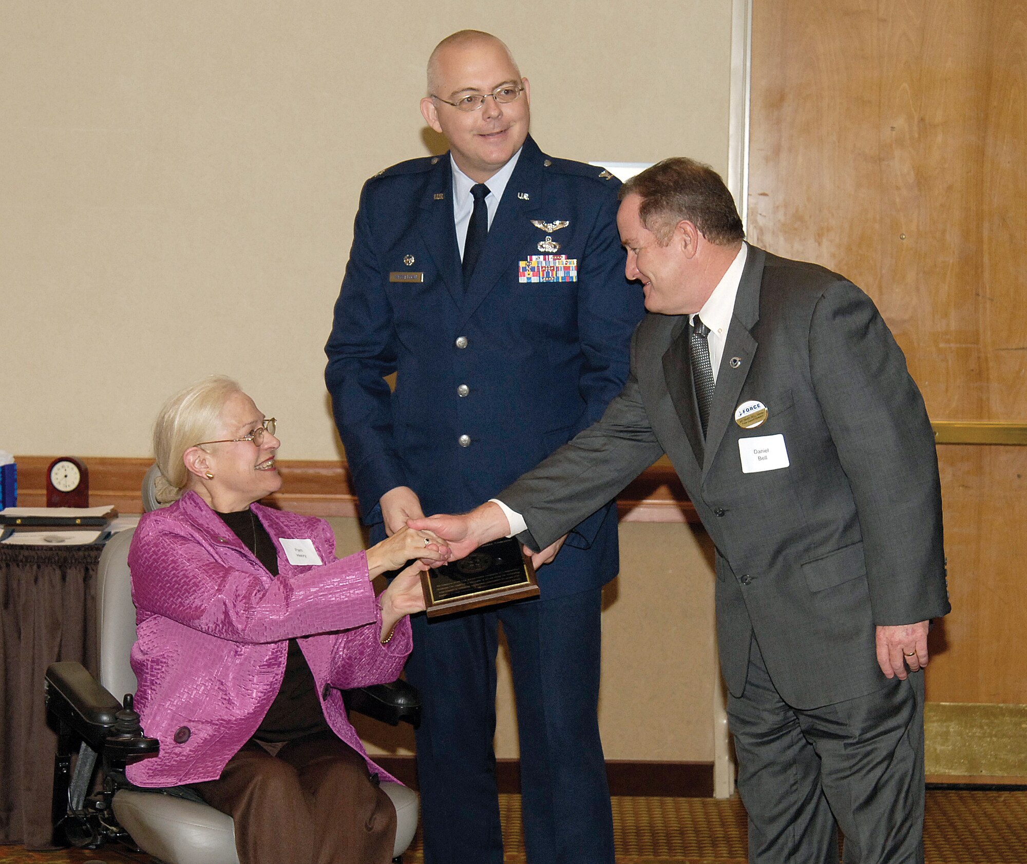 Tinker Air Force Base recently earned the Employer of the Year Award from the Mayor’s Committee on Disability Concerns during an Oct. 29 ceremony in Oklahoma City. The award was presented to Col. Herbert Wesselman, 72nd Mission Support Group commander, and Daniel Bell, 72nd Force Support Squadron director, by committee representative Pam Henry.  Tinker’s disability program manager, Lucas Hinsaw, also attended the ceremony. The award recognizes an employer for “… outstanding achievements in enhancing employment opportunities for people with disability by eliminating attitudinal and environmental barriers,” according the award ceremony program. (Air Force photo by Margo Wright)
