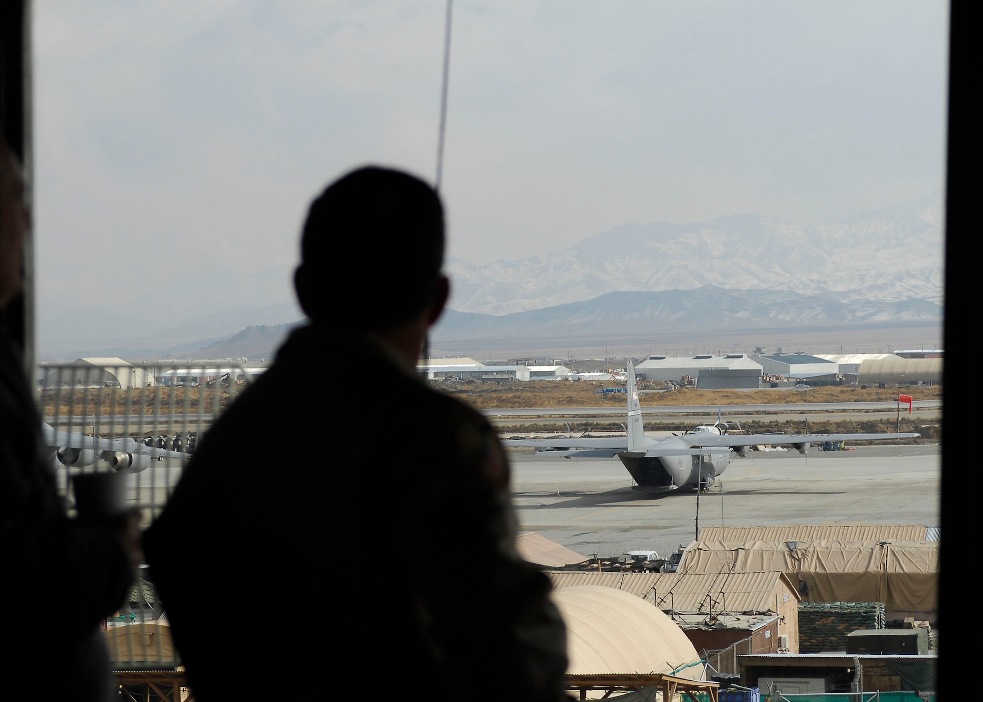 BAGRAM AIRFIELD, Afghanistan -- Brigadier General David Goldfein, the Air Combat Command Director of Air and Space Operations, looks out over the Bagram Airfield flight line, Nov. 25, 2009. Bagram is home of the 455th Air Expeditionary Wing, a composite wing that includes air mobility; electronic attack; close air support; combat search and rescue; aeromedical evacuation; and command and control assets which support the International Security Assistance Force and Operation Enduring Freedom.  (U.S. Air Force photo/Senior Airman Susan Tracy)