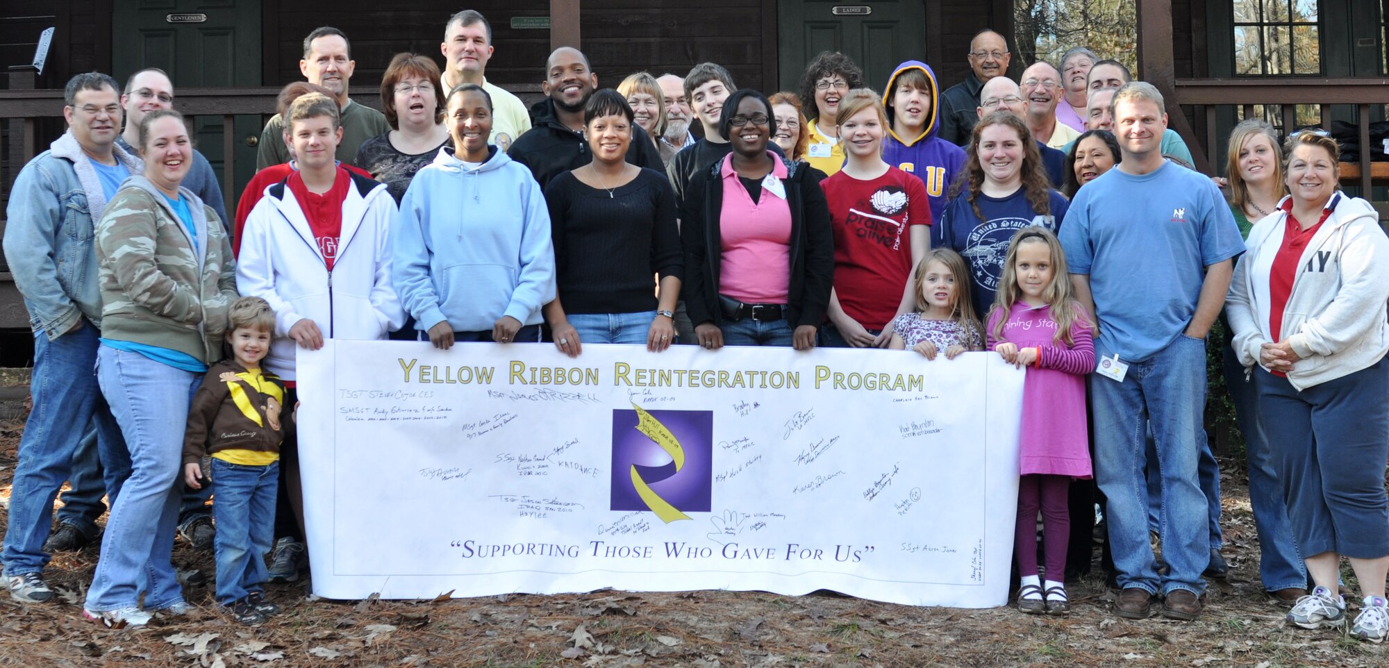 Volunteers and participants from the 917th Wing on Barksdale Air Force Base, La., gather for a group photo during a Yellow Ribbon Reintegration Program event hosted by the 917th WG at Shepherd's Pasture Conference Center in Jefferson, Texas, November 22, 2009. The YRRP is a national Department of Defense program designed to aid and support the reintegration of the military member back into their family and brings contacts and resources together in one place for those members and their families.  (U.S. Air Force photo/Airman 1st Class Crystal Jordan)
