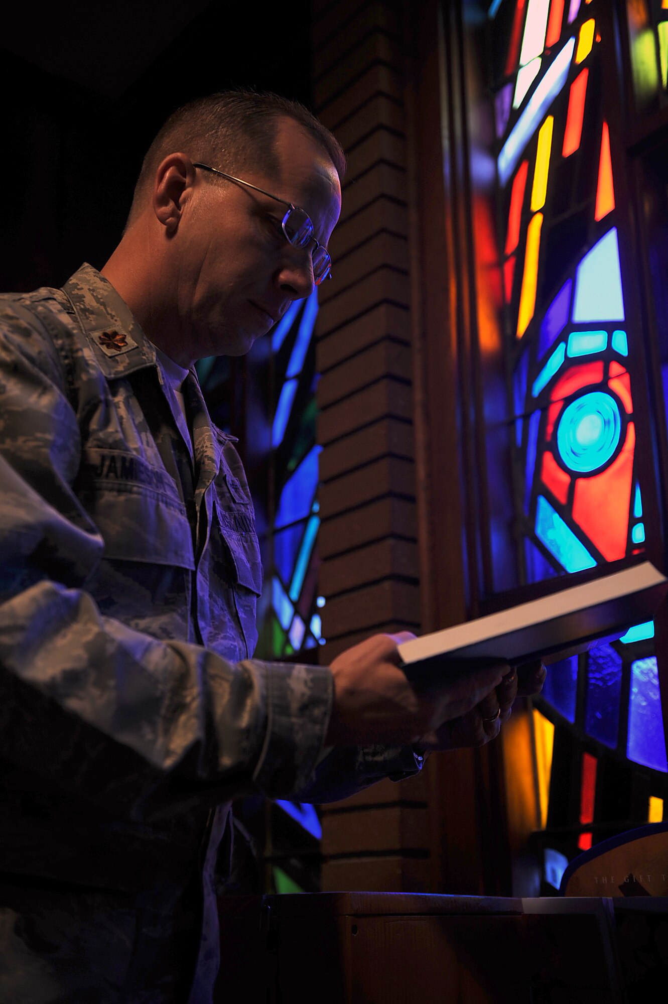 Chaplain (Maj.) Randall Jamieson, 4th Fighter Wing senior Protestant chaplain, reads the Bible in preparation for Sunday service on Seymour Johnson Air Force Base, N.C., Nov. 24, 2009. The Seymour Johnson chapel is hosting a variety of holiday services and events during December. They also offer confidential counseling to those who are feeling down or homesick during the holiday season. (U.S. Air Force photo/Senior Airman Ciara Wymbs)