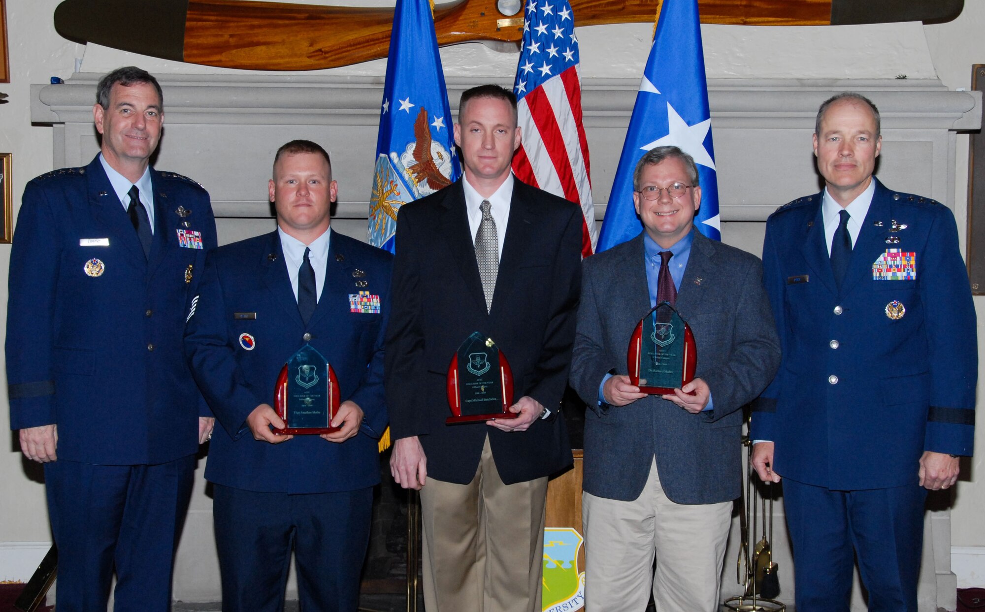 Air Education and Training Command Educator of the Year 2008-2009 awards were presented Nov. 16 at Maxwell’s Officers Club by AETC Commander Gen. Stephen Lorenz (far left). Receiving the awards (from left) are Tech. Sgt. Jonathan Mathe in the enlisted category, Capt. Michael Batchelor in the officer category and Dr. Richard Muller in the civilian category. Also shown is Lt. Gen. Allen G. Peck, commander of Air University. (U.S. Air Force photo/Bud Hancock) 
