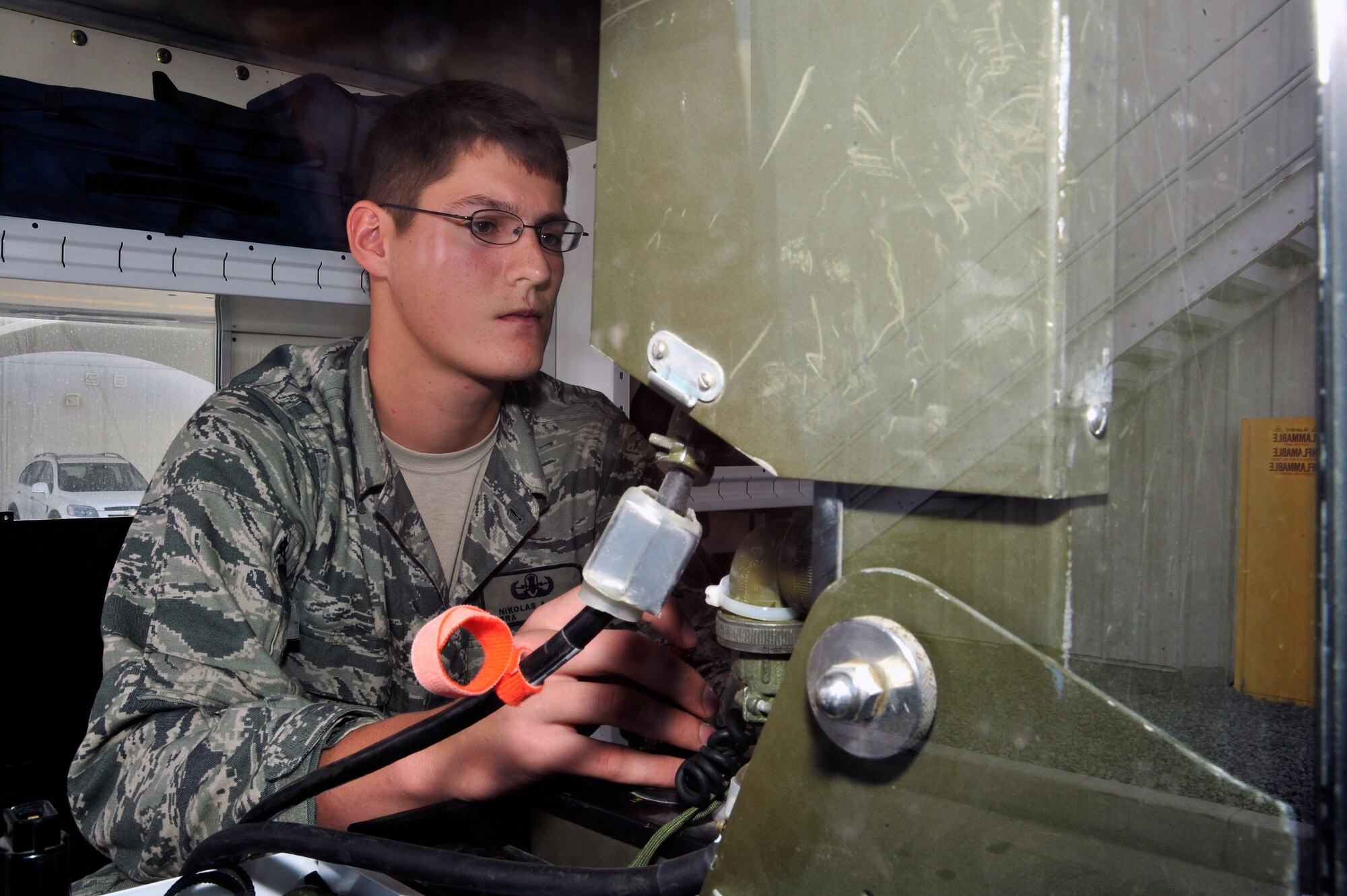 SOUTHWEST ASIA - Senior Airman Nikolas Cox, 380th Expeditionary Civil Engineer Squadron explosive ordnance disposal, remotely operates a robot down a flight of stairs Nov. 24, 2009. Airman Cox operated the robot to stay proficient on EOD training. Airman Cox is from Eielson Air Force Base, Alaska, and hails from Newport, Ore. (U.S. Air Force photo/Tech. Sgt. Charles Larkin Sr)