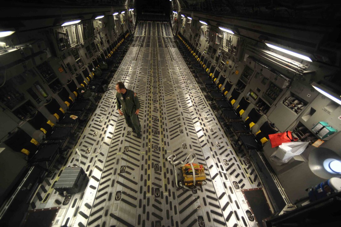 U.S. Air Force Maj.Mark Smith, 317th Airlift Squadron takes his seat on a C-17A Globemaster, prior to take off for a local training sortie from Charleston Air Force Base, S.C., November 23, 2009.  (U.S. Air Force photo by Staff Sgt. Manuel J. Martinez)