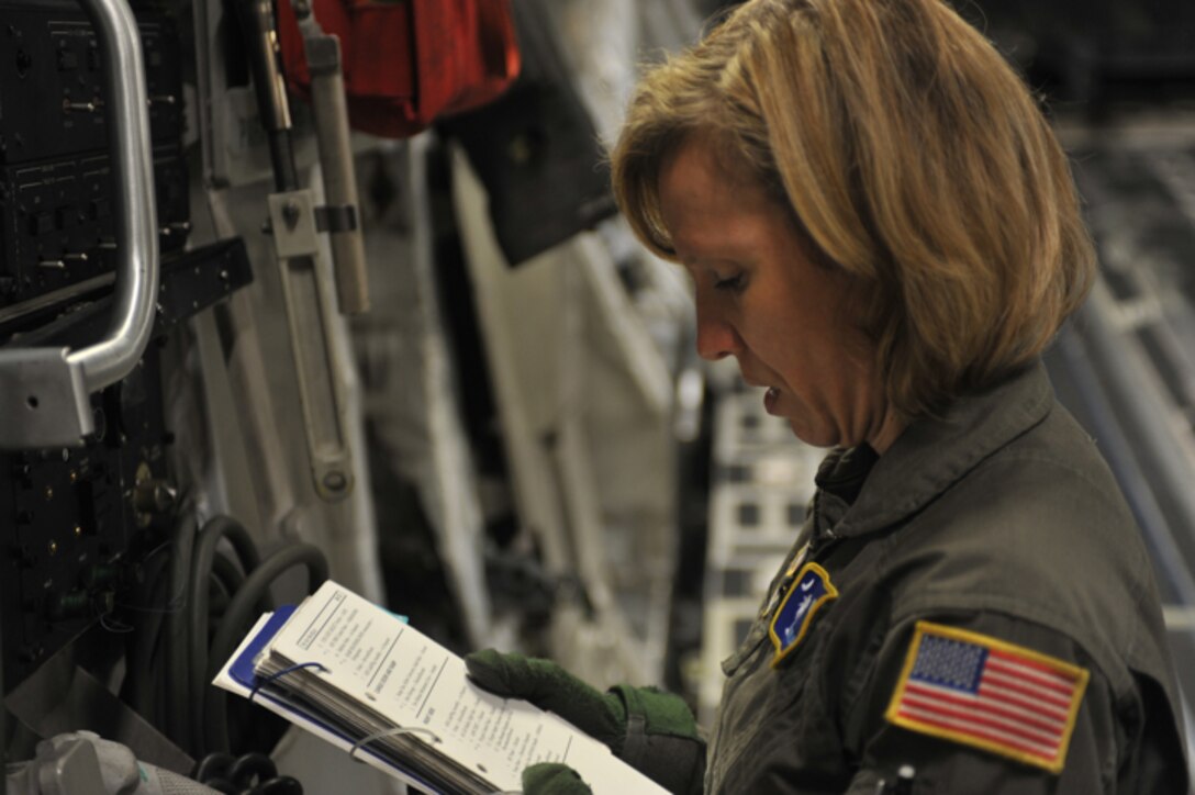 U.S. Air Force loadmaster Tech. Sgt. Lisa Crowther goes over her pre-flight checklist on a C-17 Globemaster at Charleston AFB, S.C. on Nov. 23, 2009. (U.S. Air Force photo/Staff Sgt. Quinton Russ)