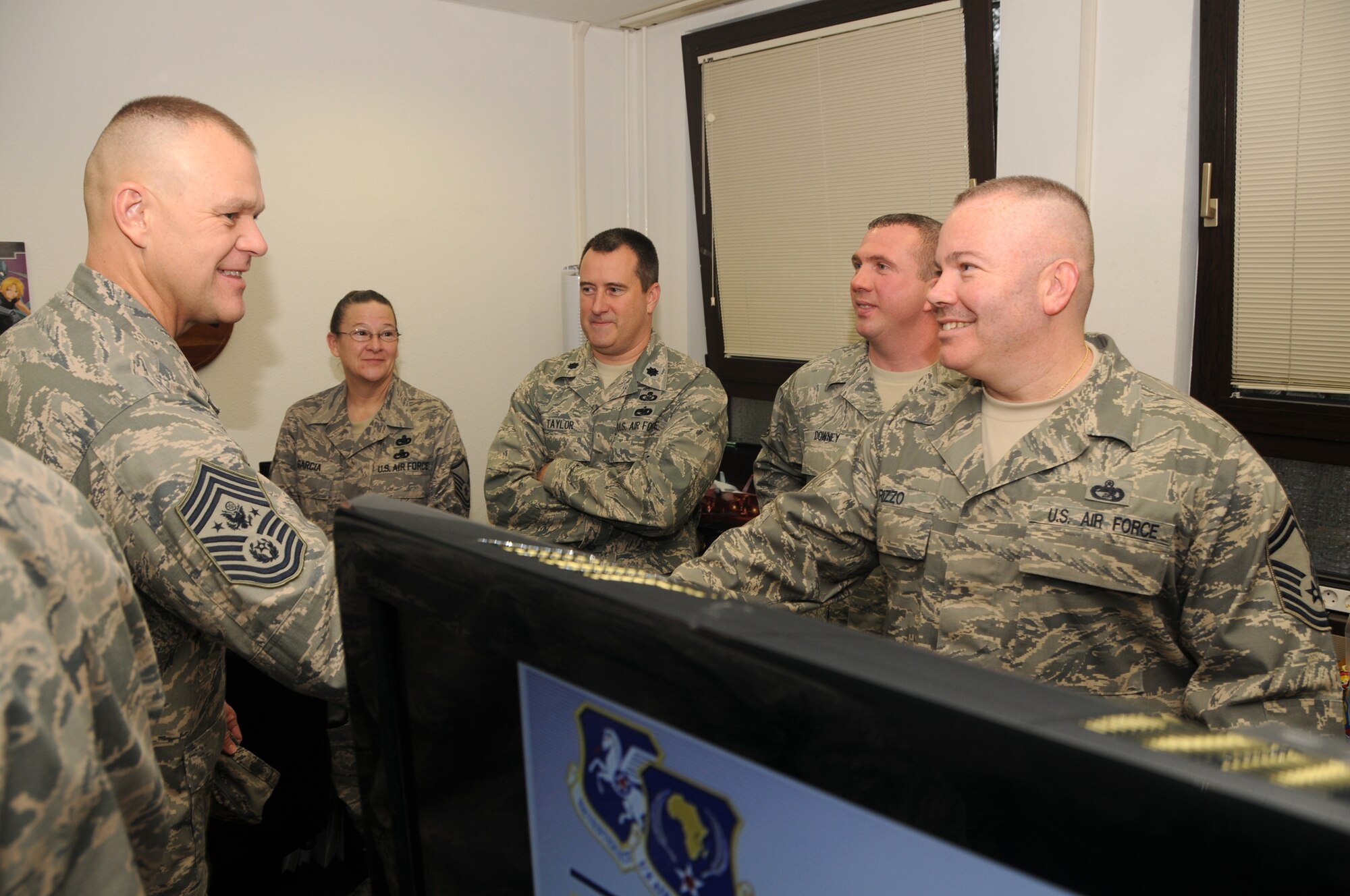 RAMSTEIN AIR BASE, Germany -- Chief Master Sergeant of the Air Force James
A. Roy (left) greets Senior Master Sgt. Rich Rizzo (right) during a visit to
17th Air Force here Nov. 24. Sergeant Rizzo, part of 17th's A 4/7 Logistics
Directorate, was joined by teammates (left to right in center) Master Sgt.
Deborah Garcia, Lt. Col. Ron Taylor, and Senior Master Sgt. Jim Downey. The
CMSAF visited with members of the component numbered air force, which serves
as the air component for U.S. Africa Command. He learned about the evolving
mission of engagement with partner nations in Africa, and conveyed holiday
wishes to the troops and their families. (USAF photo by Master Sgt. Jim
Fisher)