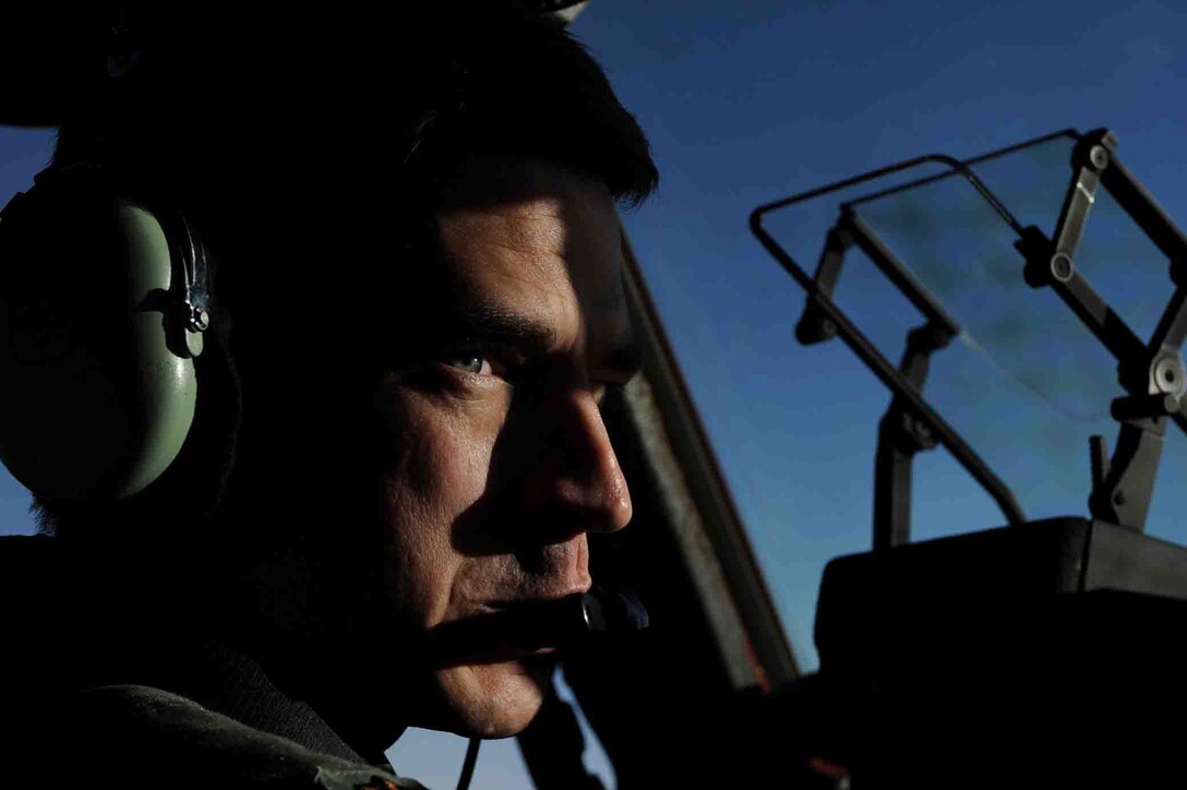 U.S. Air Force Maj. Greg Schnurrenberger, 317th AirLift Squadron, looks over to his co-pilot during a local training sortie on a C-17A Globemaster  in S.C., November 23, 2009.  (U.S. Air Force photo/Staff Sgt. Manuel J. Martinez)