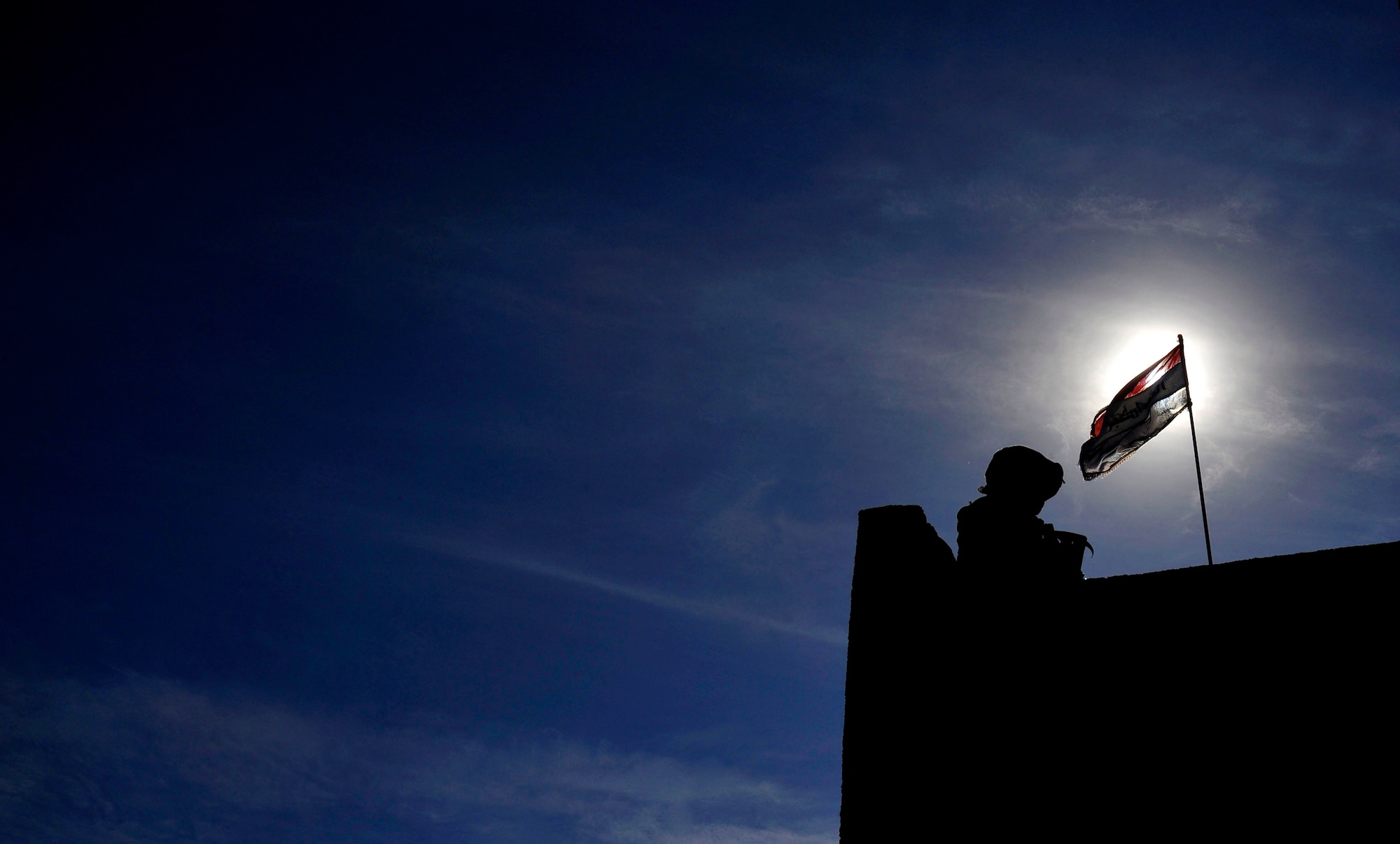 U.S. Air Force Senior Airman Joseph Mejia, 732nd Expeditionary Security Forces Squadron Det 2 fire team member, deployed to Baghdad, Iraq, provides security at a local Iraqi police station during a meeting, Nov. 15, 2009. (U.S. Air Force photo/Staff Sgt. Angelita Lawrence)