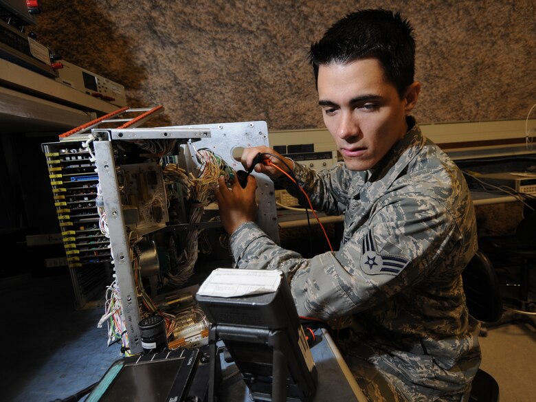 Senior Airman Logan Albano, 379th Expeditionary Maintenance Squadron precision measurement equipment laboratory journeyman, troubleshoots a 197 F-15 weapons system tester in Southwest Asia, Nov. 24, 2009. The 379 EMXS PMEL, the only PMEL shop in the Air Forces Central Command area of responsibility, supports more than 15,000 different types of equipment. Airman Albano is deployed from Seymour Johnson Air Force Base, N.C. in support of operations Iraqi Freedom and Enduring Freedom. (U.S. Air Force Photo/Tech. Sgt. Jason W. Edwards)