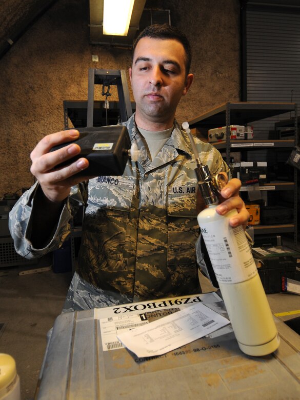 SOUTHWEST ASIA -- Senior Airman Brian Bianco, 379th Expeditionary Maintenance Squadron precision measurement equipment laboratory journeyman, calibrates a multi-gas detector, which monitors oxygen and gas levels inside aircraft fuel tanks, in Southwest Asia, Nov. 24, 2009. The 379 EMXS PMEL, the only PMEL shop in the Air Forces Central Command area of responsibility, supports more than 15,000 different types of equipment. Airman Bianco is deployed from McGuire Air Force Base, N.J. in support of operations Iraqi Freedom and Enduring Freedom. (U.S. Air Force Photo/Tech. Sgt. Jason W. Edwards)
