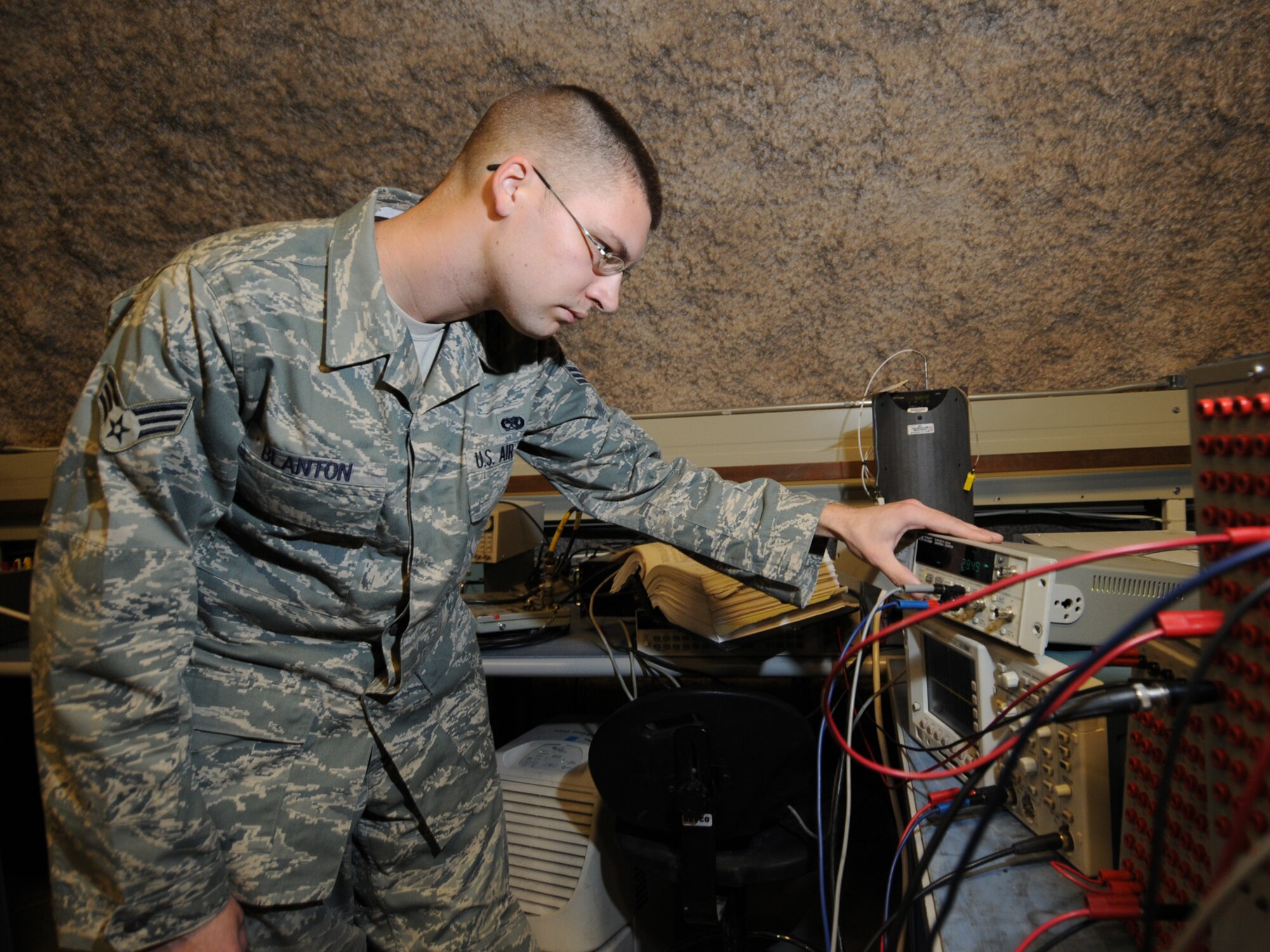Senior Airman Micah Blanton, 379th Expeditionary Maintenance Squadron precision measurement equipment laboratory journeyman, calibrates a stores management system test set in Southwest Asia, Nov. 24, 2009. The 379 EMXS PMEL, the only PMEL shop in the Air Forces Central Command area of responsibility, supports more than 15,000 different types of equipment. Airman Blanton is deployed from Shaw Air Force Base, S.C. in support of operations Iraqi Freedom and Enduring Freedom.
(U.S. Air Force Photo/Tech. Sgt. Jason W. Edwards)