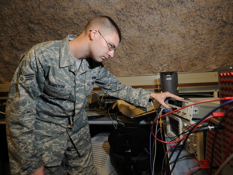 Senior Airman Micah Blanton, 379th Expeditionary Maintenance Squadron precision measurement equipment laboratory journeyman, calibrates a stores management system test set in Southwest Asia, Nov. 24, 2009. The 379 EMXS PMEL, the only PMEL shop in the Air Forces Central Command area of responsibility, supports more than 15,000 different types of equipment. Airman Blanton is deployed from Shaw Air Force Base, S.C. in support of operations Iraqi Freedom and Enduring Freedom.(U.S. Air Force Photo/Tech. Sgt. Jason W. Edwards)