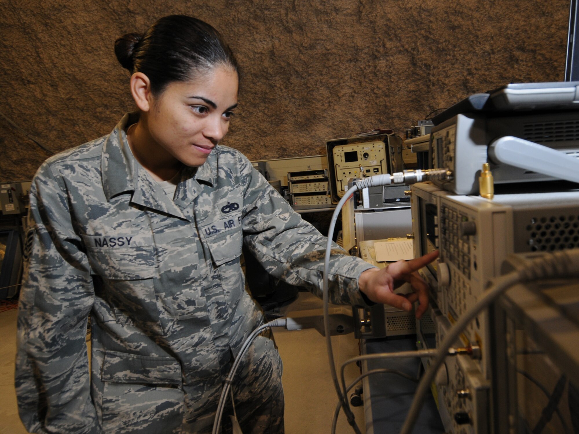Staff Sgt. Hartini Nassy, 379th Expeditionary Maintenance Squadron precision measurement equipment laboratory craftsman, calibrates a signal generator using a microwave measurement receiver in Southwest Asia, Nov. 24, 2009. The 379 EMXS PMEL, the only PMEL shop in the Air Forces Central Command area of responsibility, supports more than 15,000 different types of equipment. Sergeant Nassy is deployed from Ramstein Air Base, Germany in support of operations Iraqi Freedom and Enduring Freedom.
(U.S. Air Force Photo/Tech. Sgt. Jason W. Edwards)
