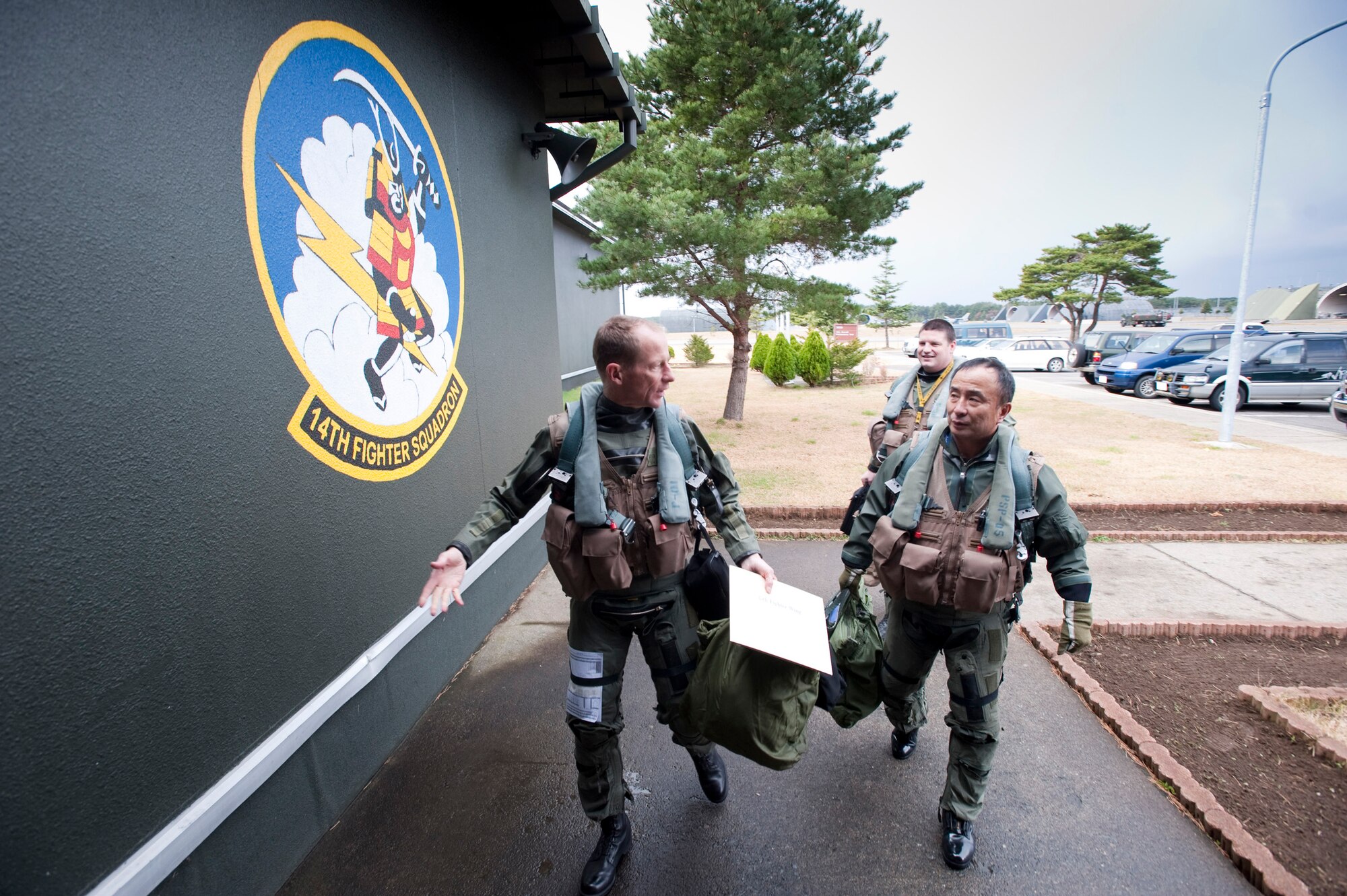 MISAWA AIR BASE, Japan -- Col. David Stilwell, 35th Fighter Wing commander, and Japan Air Self-Defense Force Lt. Gen. Kiyoshi Yada, Northern Air Defense Force commander, return to the 14th Fighter Squadron Nov. 20. General Yada experienced the wing's fighter mission, firsthand, while riding in an F-16 Fighting Falcon. (U.S. Air Force photo/Staff Sgt. Samuel Morse)