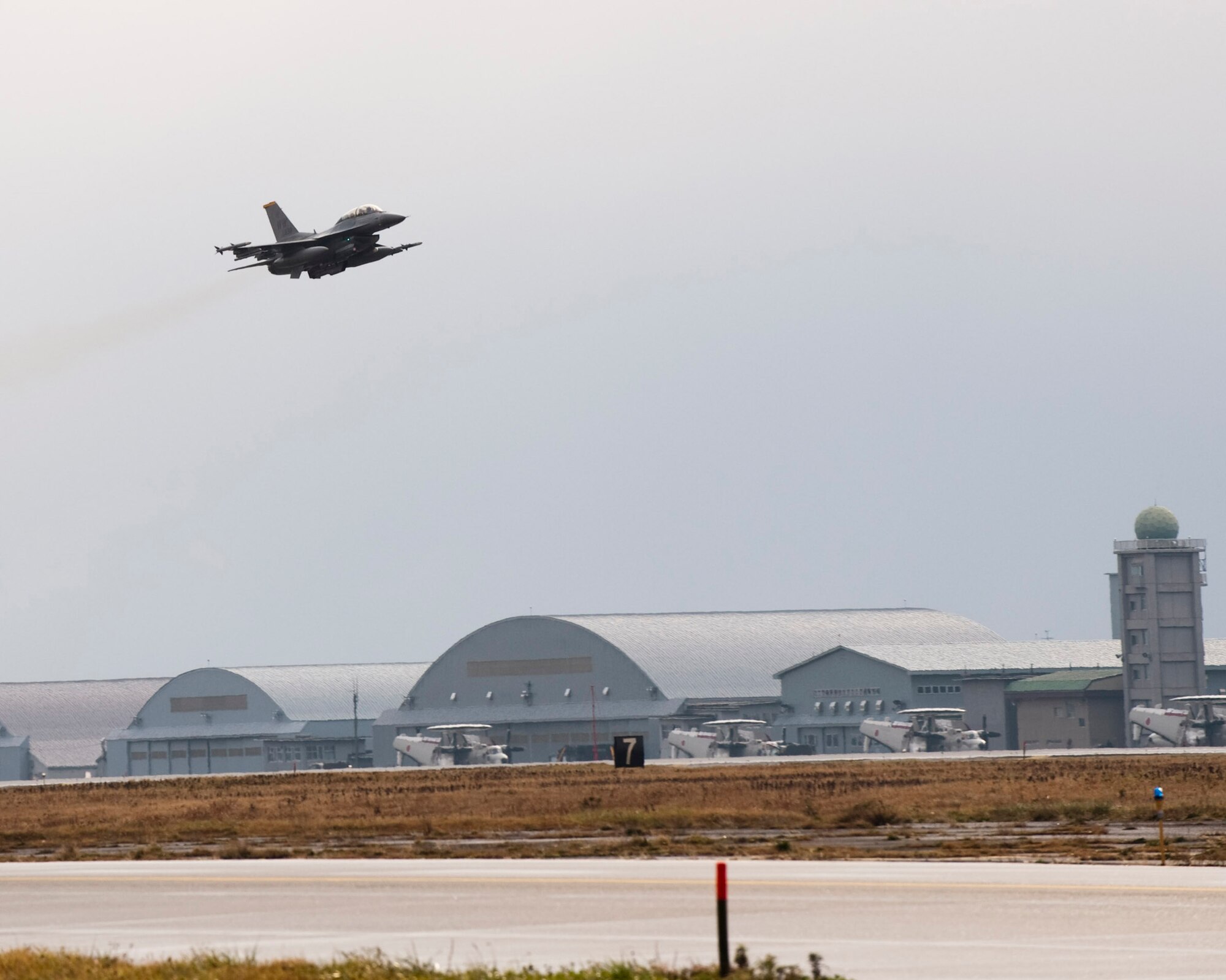 MISAWA AIR BASE, Japan -- An F-16 Fighting Falcon piloted by Col. David Stilwell, 35th Fighter Wing commander, with Japan Air Self-Defense Force Lt. Gen. Kiyoshi Yada, Northern Air Defense Force commander, takes off from Misawa Air Base Nov. 20. The flight provided an opportunity for General Yada to better understand the role and capabilities of the 35th Fighter Wing's F-16 fleet.  (U.S. Air Force photo/Staff Sgt. Samuel Morse)