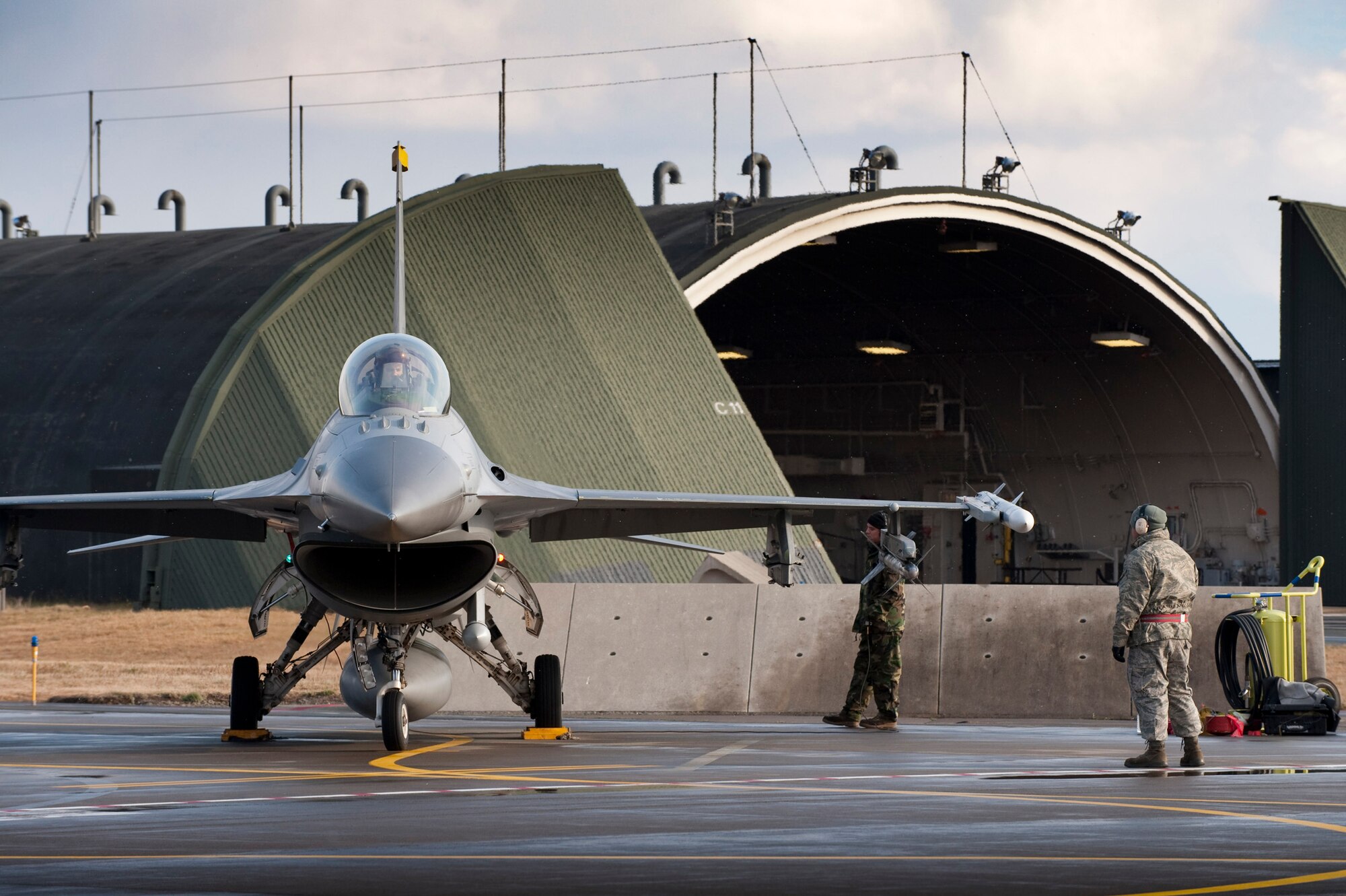 MISAWA AIR BASE, Japan -- Crews prepare an F-16 Fighting Falcon for flight Nov. 20. The F-16 is a compact, multi-role fighter capable of air-to-air and air-to-ground combat. (U.S. Air Force photo/Staff Sgt. Samuel Morse)