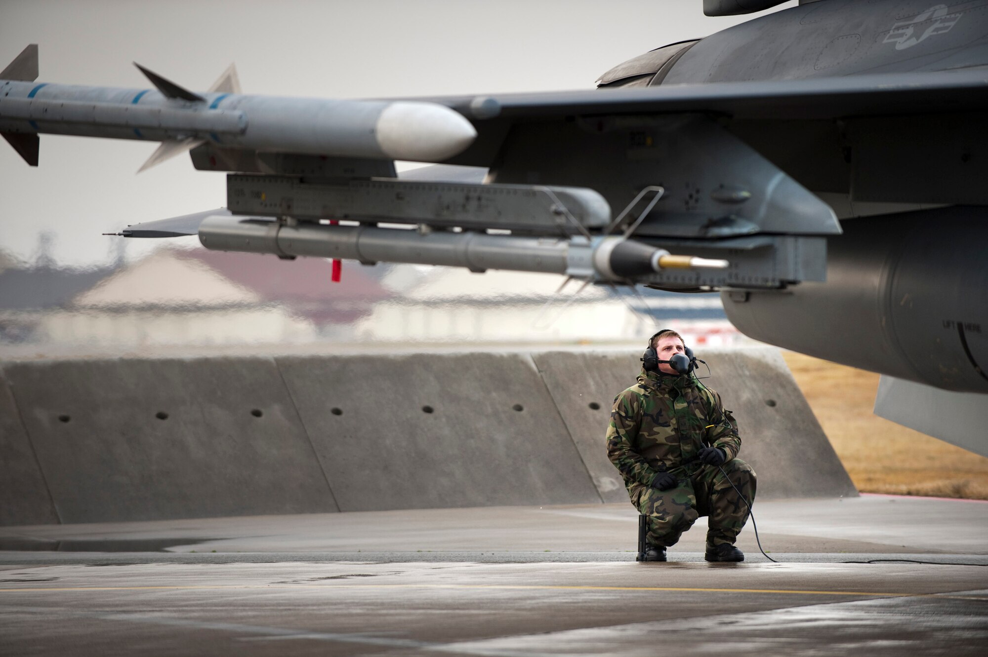 MISAWA AIR BASE, Japan -- Staff Sgt. Chad Miller, 14th Aircraft Maintenance Unit crewchief, inspects the elevators of an F-16 Fighting Falcon Nov. 20. Keeping in constant contact with the pilot, Sergeant Miller serves as the pilot's eyes and ears outside the aircraft during engine startup and preflight operational checks. (U.S. Air Force photo/Staff Sgt. Samuel Morse)