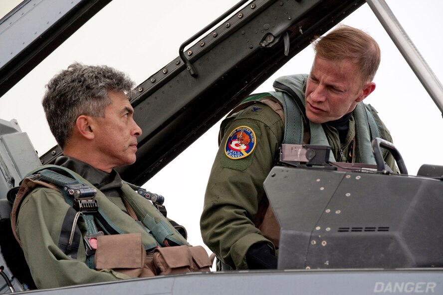 MISAWA AIR BASE, Japan -- Col. RC Craig, 35th Fighter Wing vice commander, acquaints Japan Air Self-Defense Force Maj. Gen. Hideo Maehara, 3rd Air Wing commander, with the cockpit of a F-16 Fighting Falcon Nov. 17. Colonel Craig flew General Maehara in the F-16 to give him a first-person perspective of the wing's fighter mission. (U.S. Air Force photo/Staff Sgt. Samuel Morse)