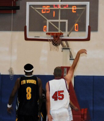 ANDERSEN AIR FORCE BASE, Guam - First Lieutenant Nicholas Welch, captain of the Andersen Bombers basketball team, sinks a shot over a member of the Sky-4-Life team here on Nov. 23rd. The Bombers took home first place at the Yokota Far East Warrior Basketball Classic that took place from Nov. 6-12th and also participated in a exhibition against Sky-4-Life on Nov. 23rd.