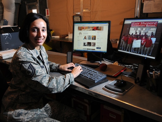 Master Sgt. Linda Adams, 379th Expeditionary Aircraft Maintenance Squadron consolidated tool kit NCOIC, updates her blog, Nov. 24, 2009, which allows her to stay in touch with her students while deployed. In addition to being an Air Force reservist, Sergeant Adams is a teacher at Kate Shepard Elementary in Mobile, Ala. She is deployed from Keesler Air Force Base, Miss. in support of operations Iraqi Freedom and Enduring Freedom.(U.S. Air Force Photo/Tech. Sgt. Jason W. Edwards) 