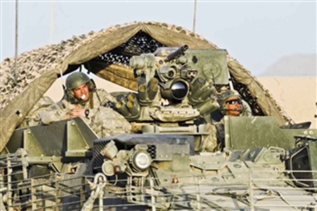 U.S. Army Spc. David Harris (left) and Staff Sgt. Nash Stratton, both with Charlie Company, 4th Battalion, 23rd Infantry Regiment, 5th Brigade Combat Team, 2nd Infantry Division, arrive at Combat Outpost Sangar, Zabul, Afghanistan, on Nov. 17, 2009.  Harris and Stratton are deployed to Afghanistan to conduct counterinsurgency operations.  