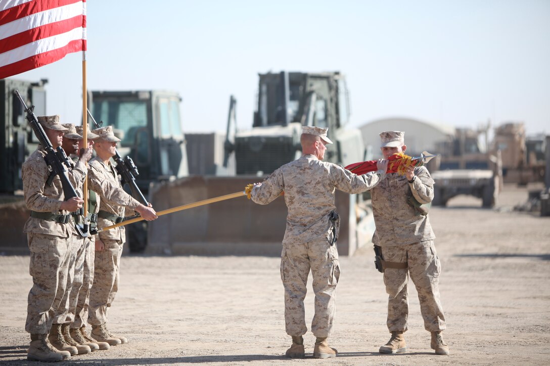 Lt. Col. Ted Adams (right), commanding officer, 9th Engineer Support Battalion, and Sgt. Maj. James Calbough, sergeant major, 9th ESB, case the battalion colors during a transfer of authority ceremony at Camp Leatherneck, Afghanistan, Nov. 25. The Marines of 9th ESB, 1st Marine Logistics Group (Forward), transferred authority to the North Carolina-based 8th Engineer Support Battalion, officially marking the completion of their 7-month deployment in support of Operation Enduring Freedom.