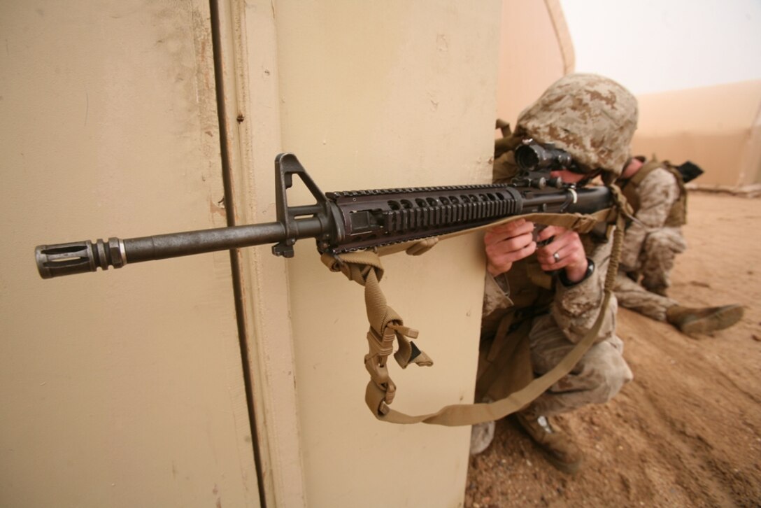 Sgt. Kyle Kennedy, from Dowagiac, Mich., provides security during a training exercise here Nov. 26. Kennedy, with Company F, Battalion Landing Team 2/4, is deployed here with the 11th Marine Expeditionary Unit.