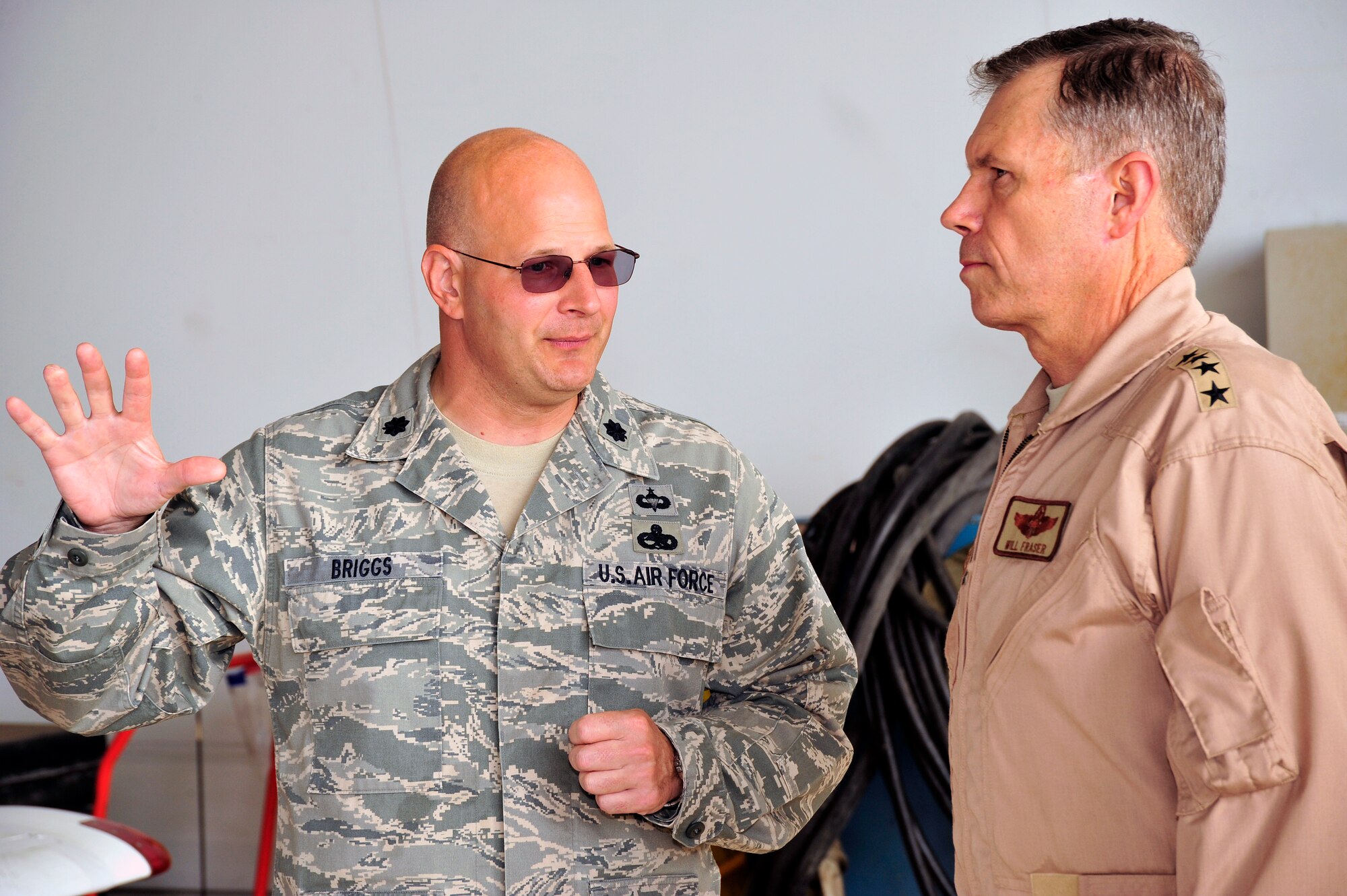 SOUTHWEST ASIA -Lt. Col. Raymond Briggs, 380th Expeditionary Maintenance Group deputy commander, briefs Gen. William Fraser III, Air Combat Command commander Nov. 23, 2009. Colonel Briggs briefed on current plans to streamline operations of the 380th Air Expeditionary Wing. (U.S. Air Force photo/Tech. Sgt. Charles Larkin Sr)