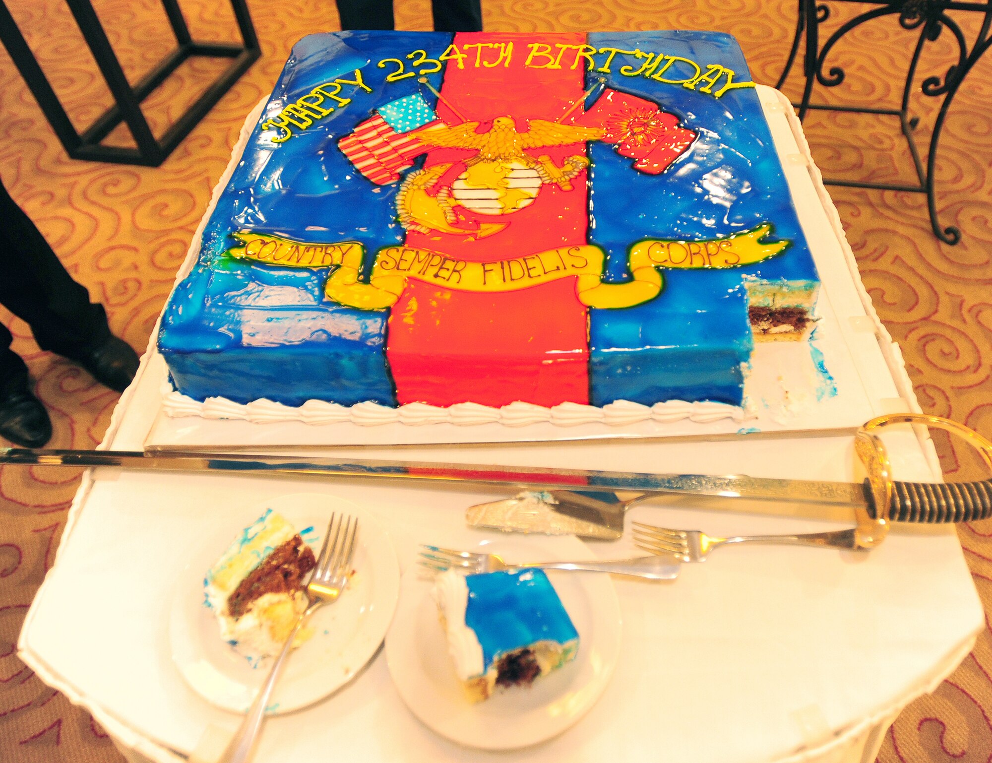 BISHKEK, Kyrgyzstan -- The Marine Security Guard Detachment of the U.S. Embassy in Kyrgyzstan held a formal ceremony honoring the recent 234th Birthday of the Corps in Bishkek recently. The first piece of cake was cut for the Guest of Honor Tatiana Gfoeller, U.S. Ambassador to Kyrgyzstan, while the second was cut for the eldest and youngest Marines present at the ceremony. (U.S. Air Force photo/Senior Airman Steele C. G. Britton)