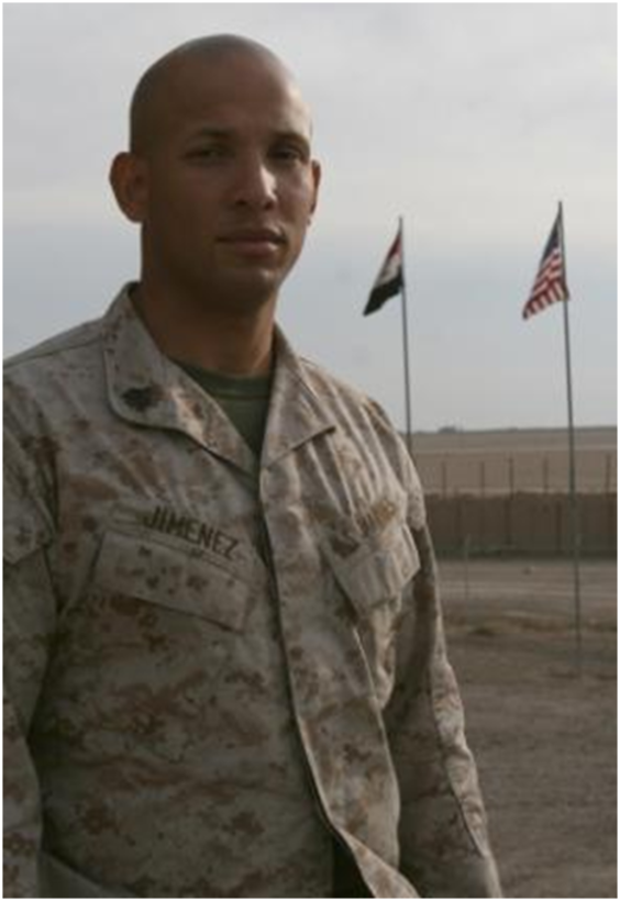 Sgt. Miguel A. Jimenez, the Personal Security Detachment noncommissioned officer-in-charge, Combat Logistics Regiment 27 (Forward), stands outside aboard Camp Al Taqaddum, Iraq, Nov. 27, 2009.  Jimenez received a phone call from the President of the United States, who wished him a happy Thanksgiving holiday, Nov. 26, 2009. (U.S. Marine Corps photograph by Cpl. M. M. Bravo)