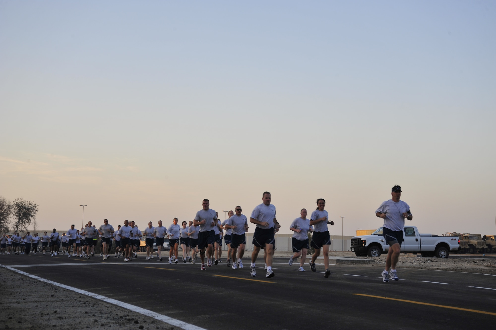 SOUTHWEST ASIA--Servicemembers run during the 5K Turkey Trot in the morning of Nov. 26, 2009. More than 150 runners participated in the event. (U.S. Air Force photo/Tech. Sgt. Charles Larkin Sr.)