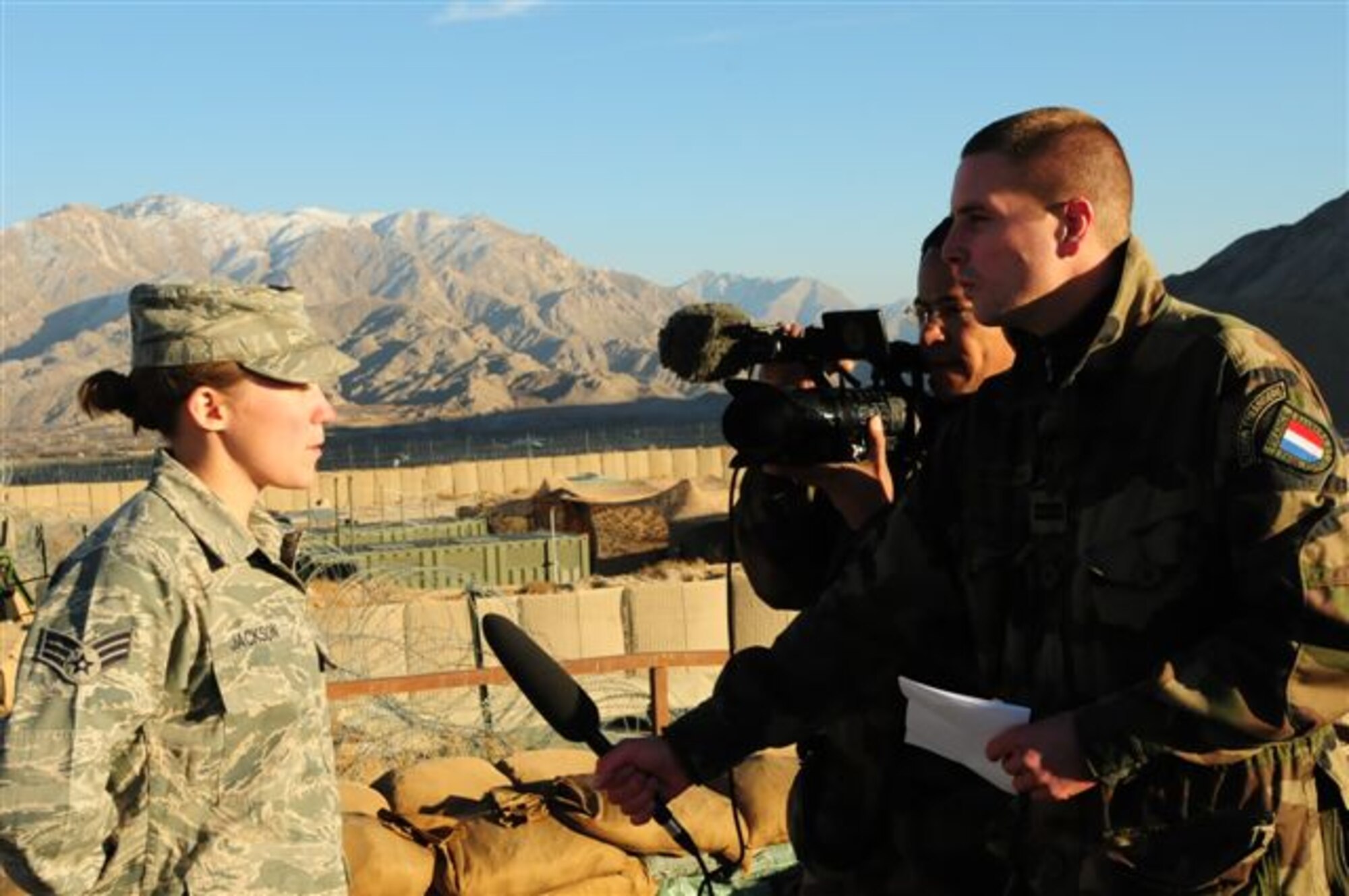 FORWARD OPERATING BASE MORALES-FRAZIER, Afghanistan - Senior
Airman Ashley Jackson, a medic with Provincial Reconstruction Team Kapisa,
conducts an interview with military reporters from French Task Force La
Fayette prior to her receiving a phone call from President Barack Obama Nov.
26, 2009. Airman Jackson is originally from Lakeville, Minn., and is
deployed to Afghanistan from Eielson Air Force Base, Alaska. (U.S. Air Force photo/Capt. Darrick Lee)
