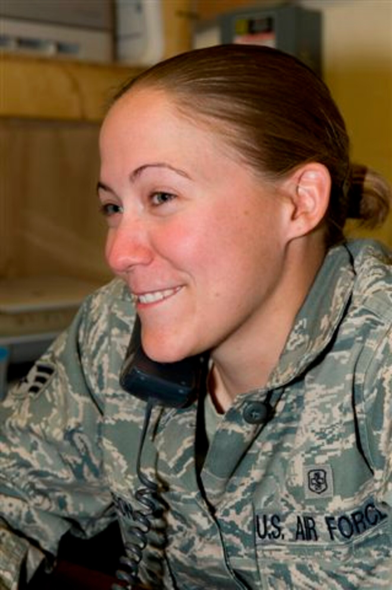 FORWARD OPERATING BASE MORALES-FRAZIER, Afghanistan - Senior Airman Ashley Jackson, a medic with Provincial Reconstruction Team Kapisa,
smiles as she listens to President Obama's Thanksgiving message. Jackson is
originally from Lakeville, Minn., and is deployed to Afghanistan from Eielson Air Force Base, Alaska. (Photo courtesy of French Task Force La Fayette Public
Affairs Office, Adjutant Thorel)
