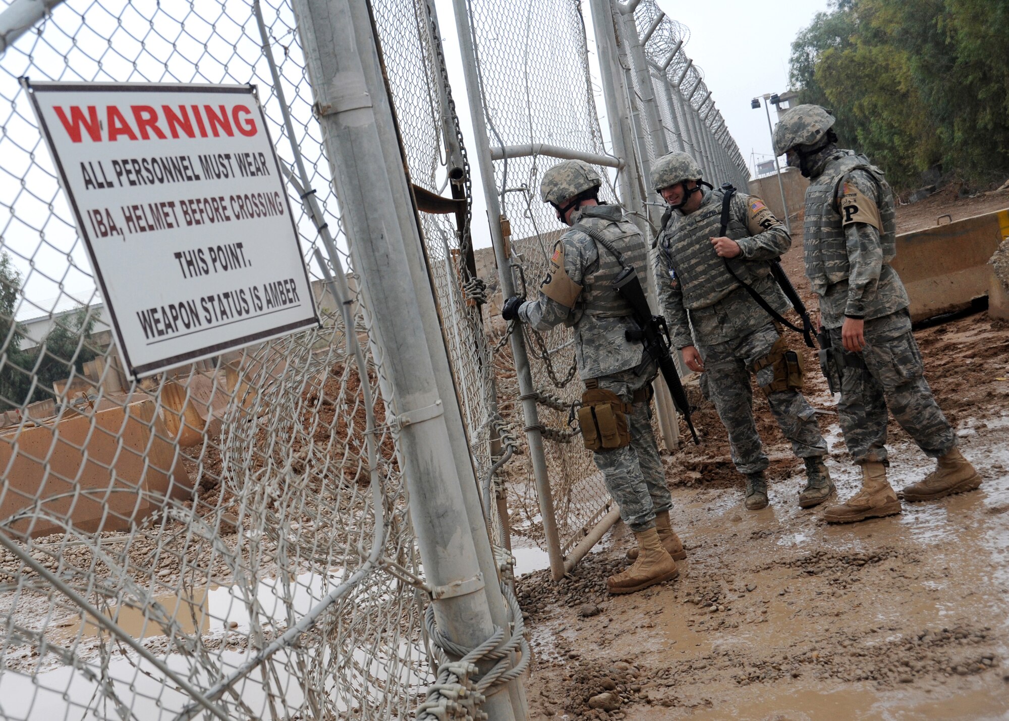 JOINT BASE BALAD, Iraq -- 332nd Expeditionary Civil Engineer force protection escorts prepare to conduct a sweep for contraband items left by local nationals at the gravel yard Nov. 19, 2009. Airmen deployed as FP escorts protect resources while providing safety and security on JBB. (U.S. Air Force photo/Senior Airman Christopher Hubenthal) 