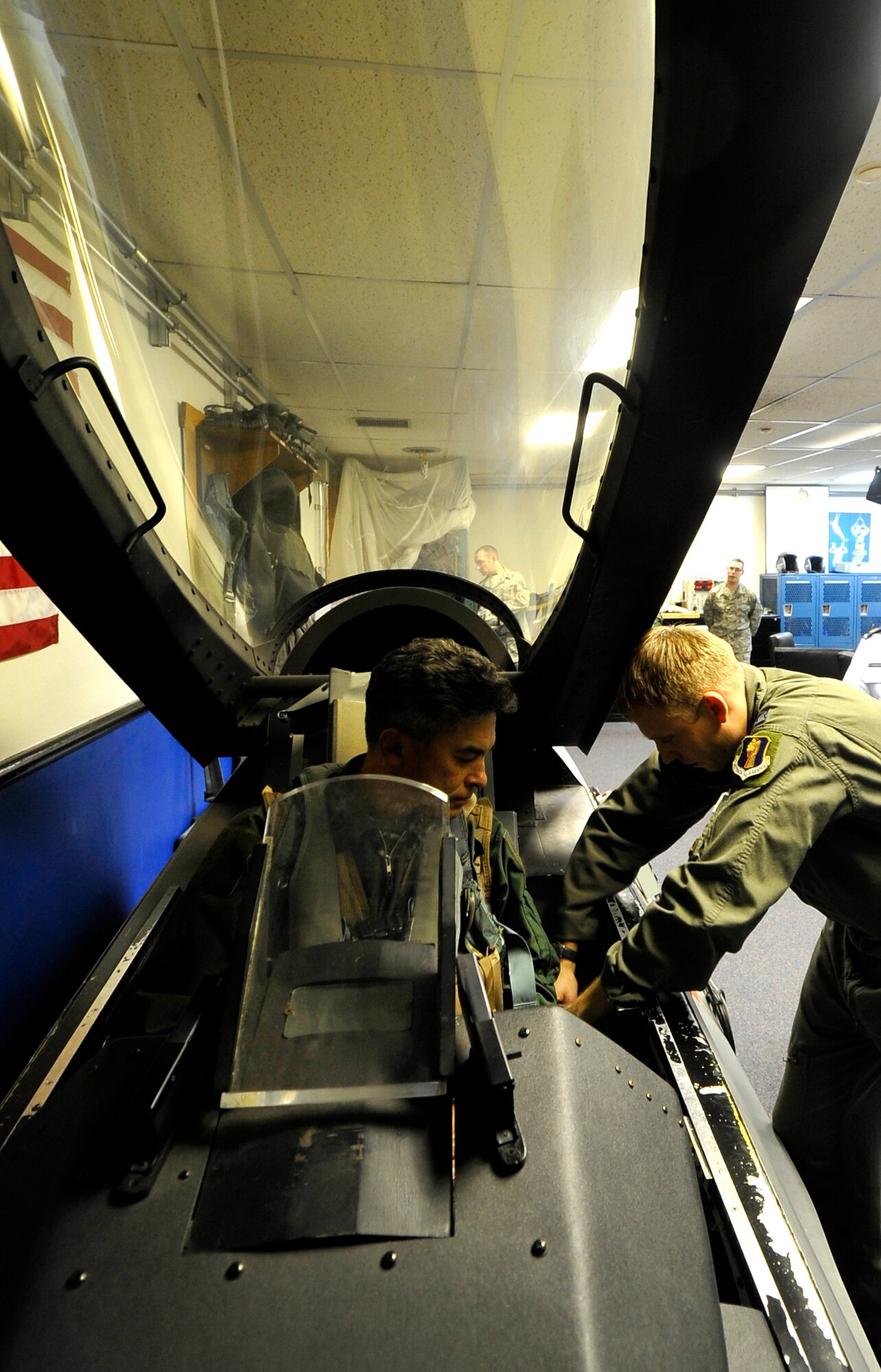 MISAWA AIR BASE, Japan --  Capt. Michael Powell, 13th Fighter Squadron aircrew flight equipment explains the egress procedures to  Maj. Gen. Hiroaki Maehara, 3rd Air Wing commander before his familiarization flight with Col. RC Craig, 35th Fighter Wing vice commander Nov. 16. General Maehara has been the commander for the 3rd Air Wing for approximately one year. (U.S. Air Force photo/Staff Sgt. Chad C. Strohmeyer)