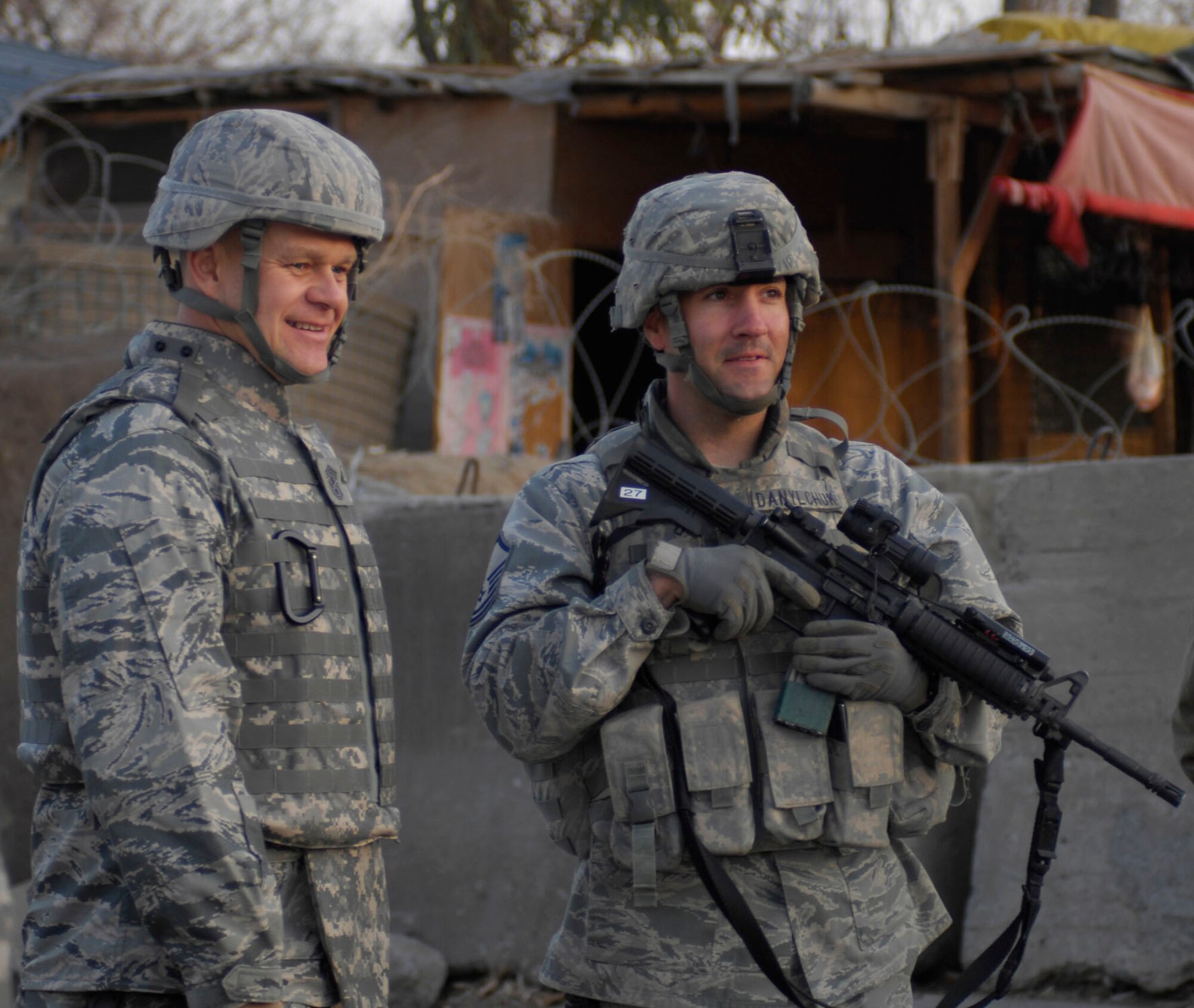 BAGRAM AIRFIELD, Afghanistan -- Chief Master Sgt. of the Air Force James A. Roy views the town outside of one of the entry points at Bagram with Master Sgt. Robert Danylchuck, 455th Expeditionary Security Forces, noncommissioned officer in charge, Alpha sector.  Chief Roy visited Bagram to talk with Airmen from the 455th Expeditionary Security Forces Squadron to hear what the Airmen had on their minds in a deployed environment. "I wanted to also thank you, your spouses and your family for the sacrifices you and they are making while you are deployed defending our nation," he said.  Sergeant Danylchuck is a 17-year Air Force veteran deployed from Davis-Monthan Air Force Base, Ariz.  (U.S. Air Force photo/Tech. Sgt. John Jung)